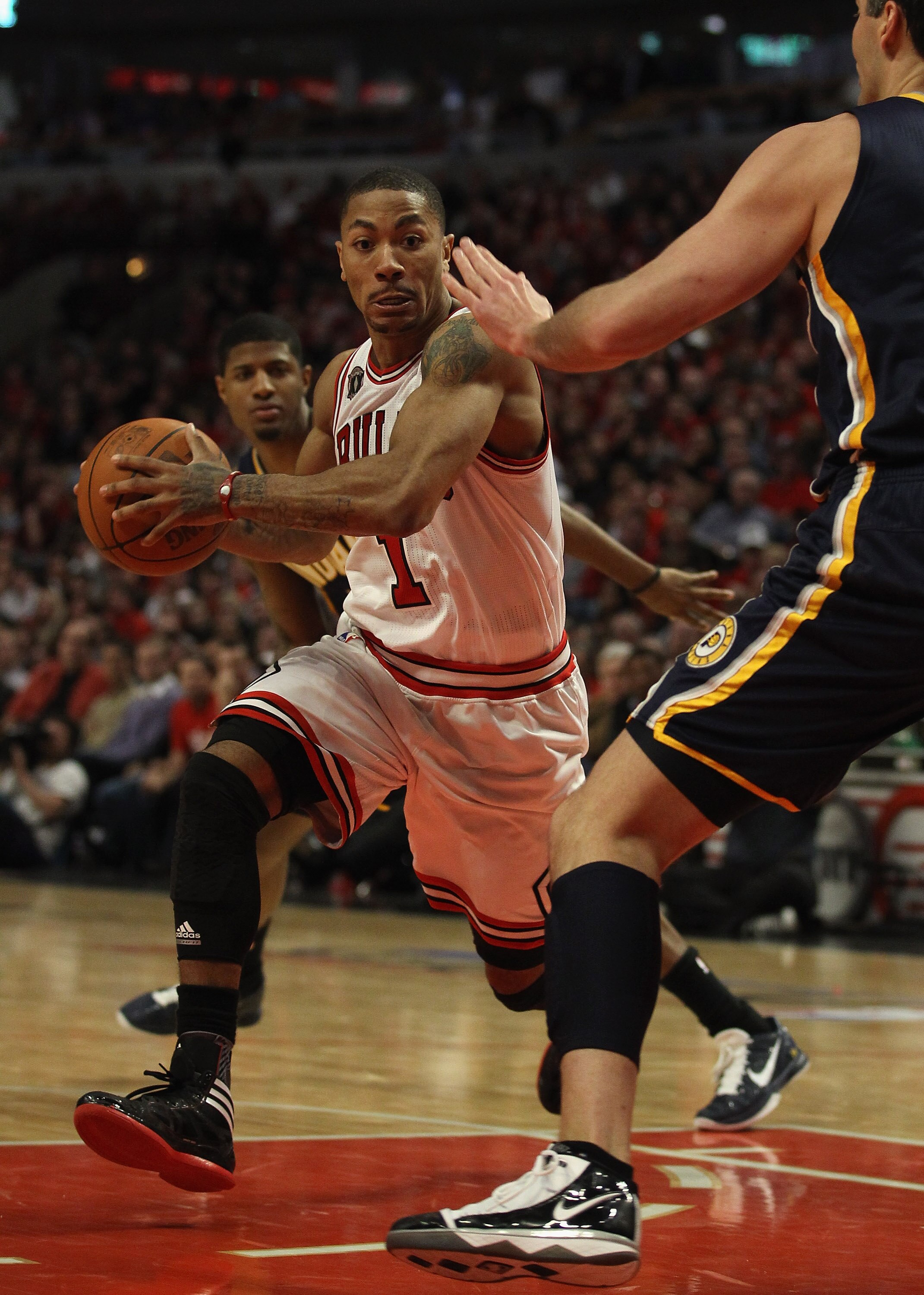 CHICAGO, IL - APRIL 18: Derrick Rose #1 of the Chicago Bulls moves against Jeff Foster #10 of the Indiana Pacers in Game Two of the Eastern Conference Quarterfinals in the 2011 NBA Playoffs at the United Center on April 18, 2011 in Chicago, Illinois. The