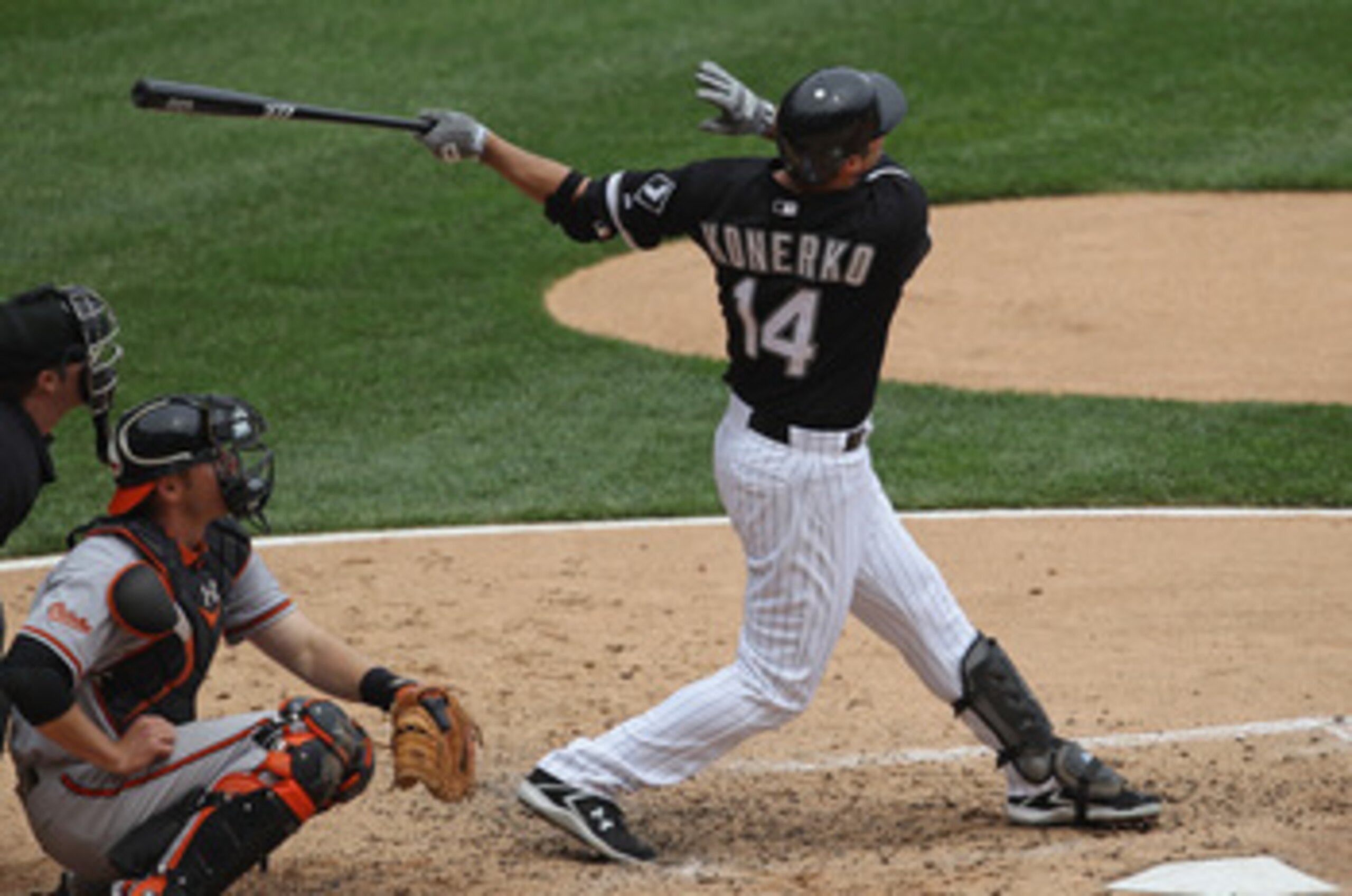 CHICAGO, IL - MAY 01: Paul Konerko #14 of the Chicago White Sox hits the ball against the Baltimore Orioles at U.S. Cellular Field on May 1, 2011 in Chicago, Illinois. The Orioles defeated the White Sox 6-4. (Photo by Jonathan Daniel/Getty Images)