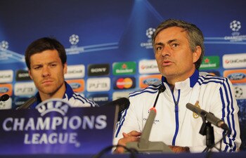 LONDON, ENGLAND - APRIL 12:  Jose Mourinho the Real Madrid manager and player Xabi Alonso talk to the media during a press conference on the eve of their UEFA Champions League quarter-final second leg match against Tottenham Hotspur at White Hart Lane on 