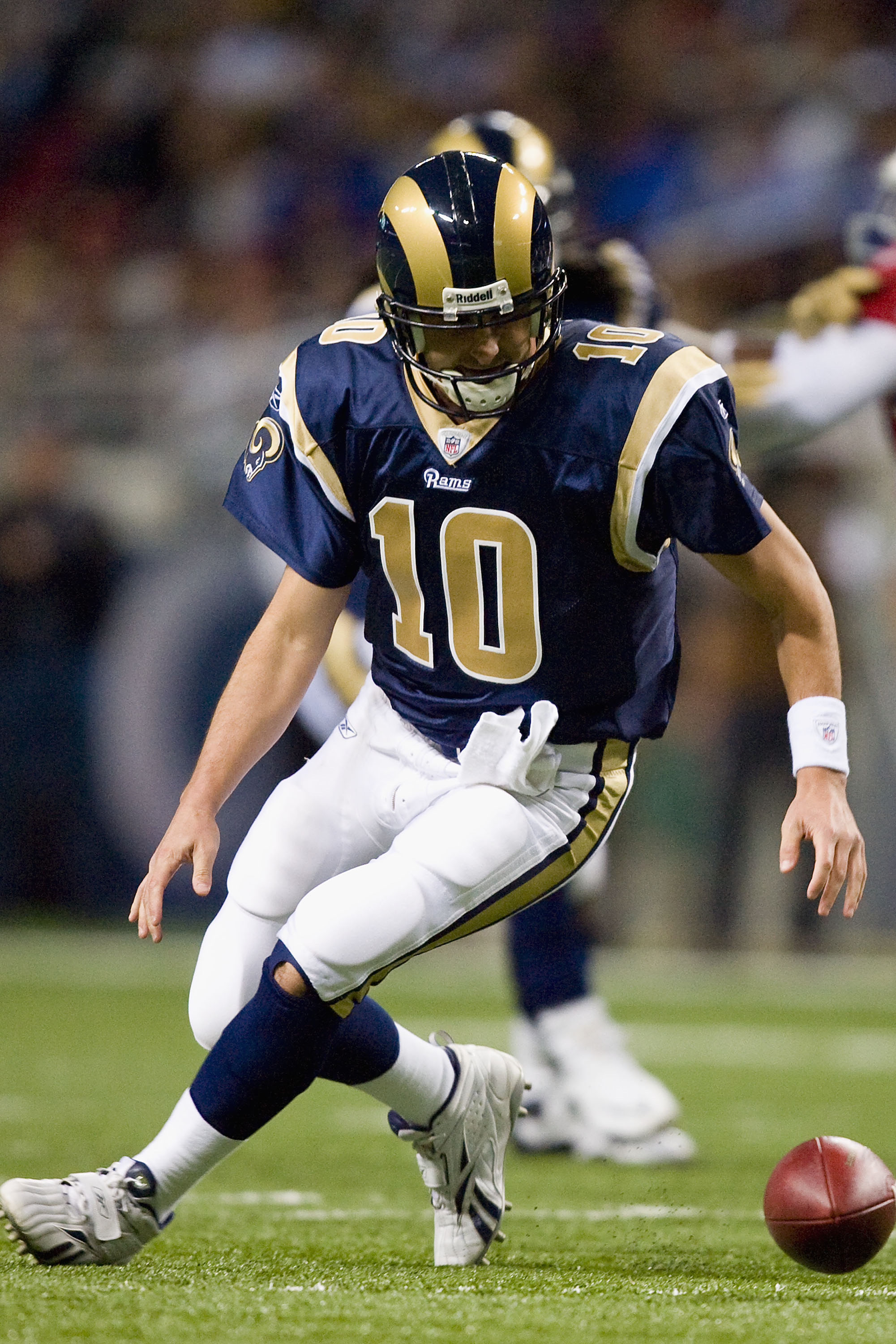 ST. LOUIS - NOVEMBER 22: Marc Bulger #10 of the St. Louis Rams fumbles the ball against the Arizona Cardinals at the Edward Jones Dome on November 22, 2009 in St. Louis, Missouri.  The Cardinals beat the Rams 21-13.  (Photo by Dilip Vishwanat/Getty Images