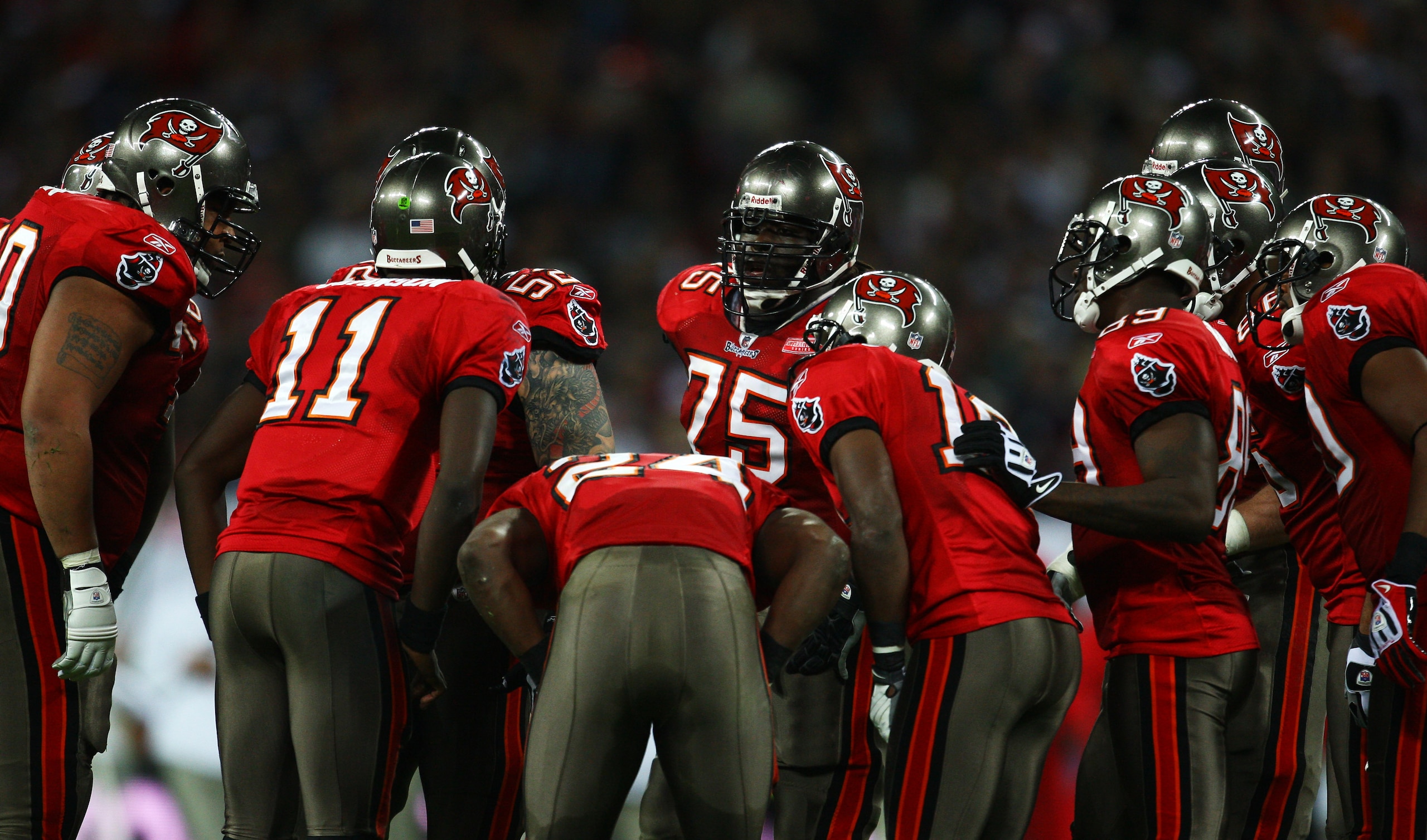 LONDON, ENGLAND - OCTOBER 25: The Tampa Bay Buccaneers offense in discussion during the NFL International Series match between New England Patriots and Tampa Bay Buccaneers at Wembley Stadium on October 25, 2009 in London, England. This is the third occas LONDON, ENGLAND - OCTOBER 25: The Tampa Bay Buccaneers offense in discussion during the NFL International Series match between New England Patriots and Tampa Bay Buccaneers at Wembley Stadium on October 25, 2009 in London, England. This is the third occas