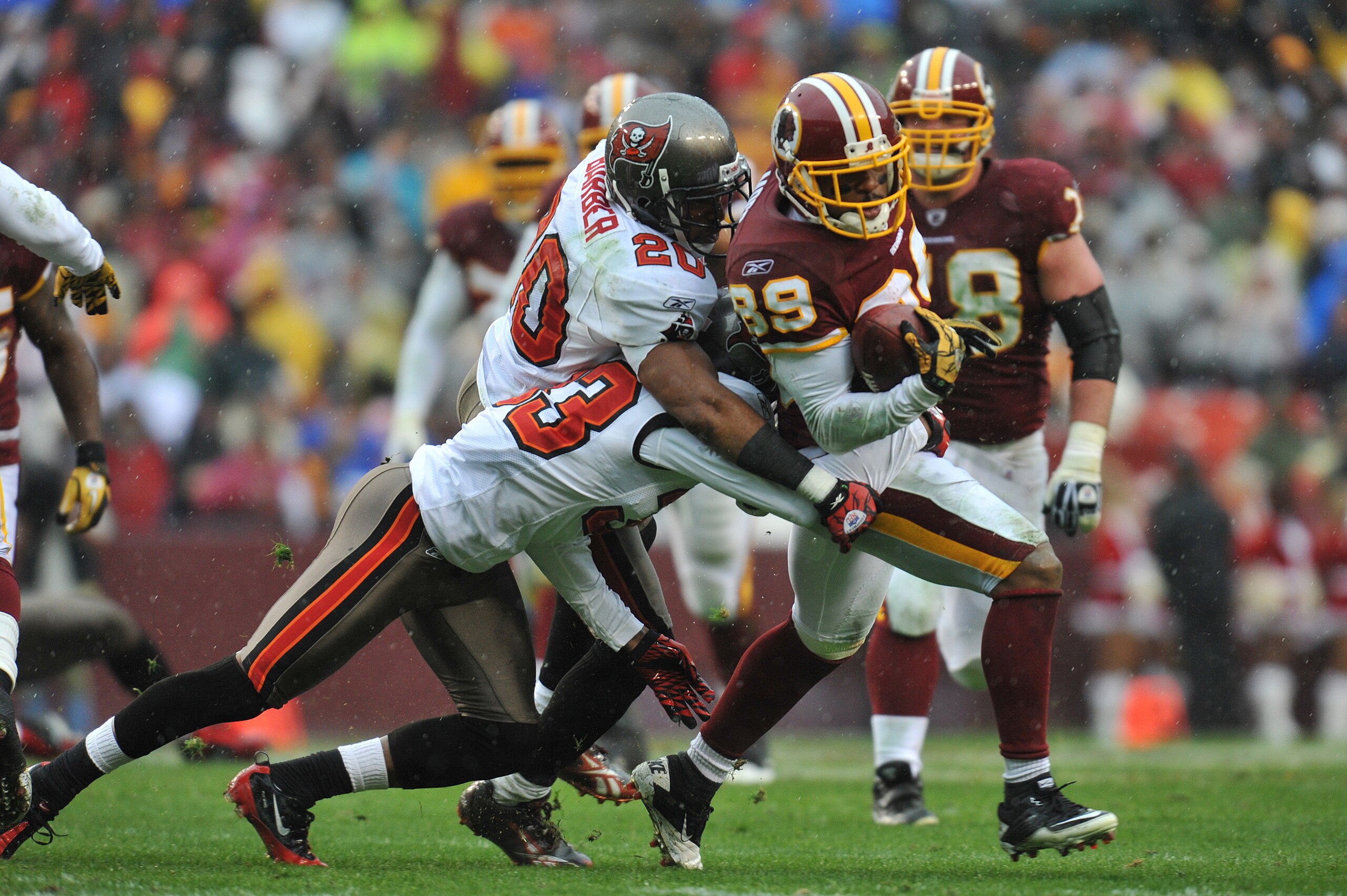 LANDOVER, MD - DECEMBER 12: Santana Moss #89 of the Washington Redskins runs the ball after a catch during the game against the Tampa Bay Buccaneers at FedExField on December 12, 2010 in Landover, Maryland. The Buccaneers defeated the Redskins 17-16. (P LANDOVER, MD - DECEMBER 12: Santana Moss #89 of the Washington Redskins runs the ball after a catch during the game against the Tampa Bay Buccaneers at FedExField on December 12, 2010 in Landover, Maryland. The Buccaneers defeated the Redskins 17-16. (P