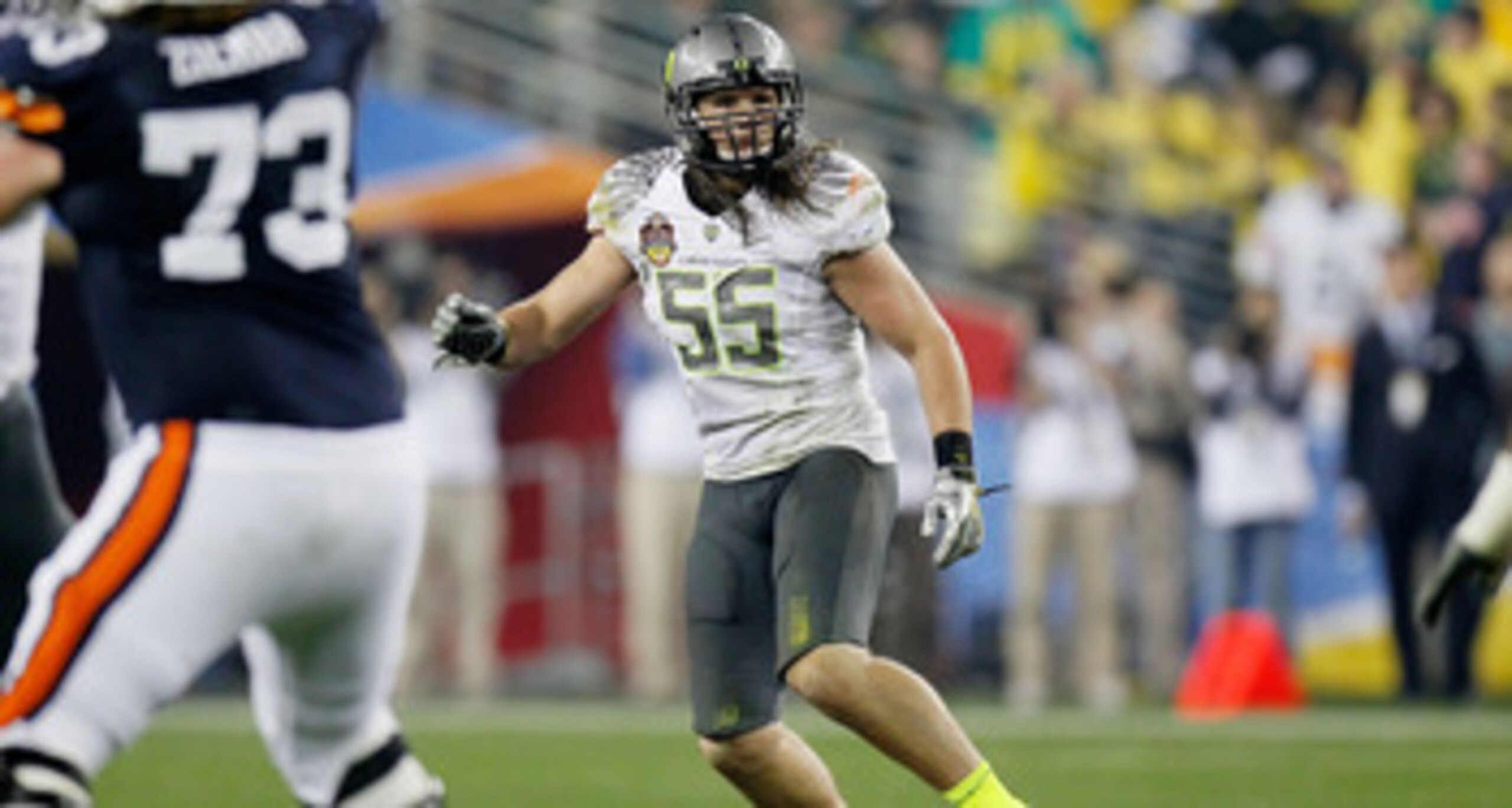 GLENDALE, AZ - JANUARY 10:  Casey Matthews #55 of the Oregon Ducks watches the play against the Auburn Tigers during the Tostitos BCS National Championship Game at University of Phoenix Stadium on January 10, 2011 in Glendale, Arizona.  (Photo by Kevin C.