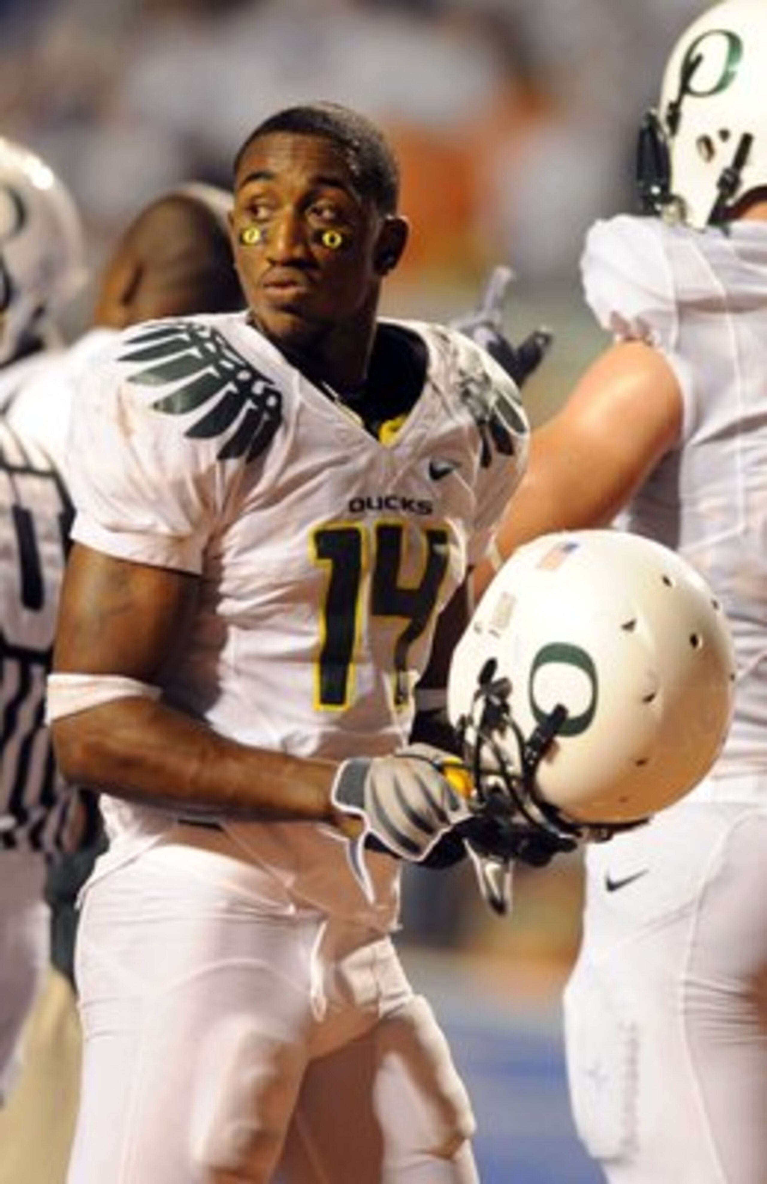BOISE, ID - SEPTEMBER 3: Safety Javes Lewis #14 of the Oregon Ducks puts his helmet back on after a time out in the third quarter of the game against the Boise State Broncos on September 3, 2009 at Bronco Stadium in Boise, Idaho. Boise State won the game 