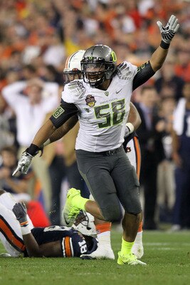GLENDALE, AZ - JANUARY 10: Kenny Rowe #58 of the Oregon Ducks reacts during their game against the Auburn Tigers during the Tostitos BCS National Championship Game at University of Phoenix Stadium on January 10, 2011 in Glendale, Arizona. (Photo by Jona GLENDALE, AZ - JANUARY 10: Kenny Rowe #58 of the Oregon Ducks reacts during their game against the Auburn Tigers during the Tostitos BCS National Championship Game at University of Phoenix Stadium on January 10, 2011 in Glendale, Arizona. (Photo by Jona