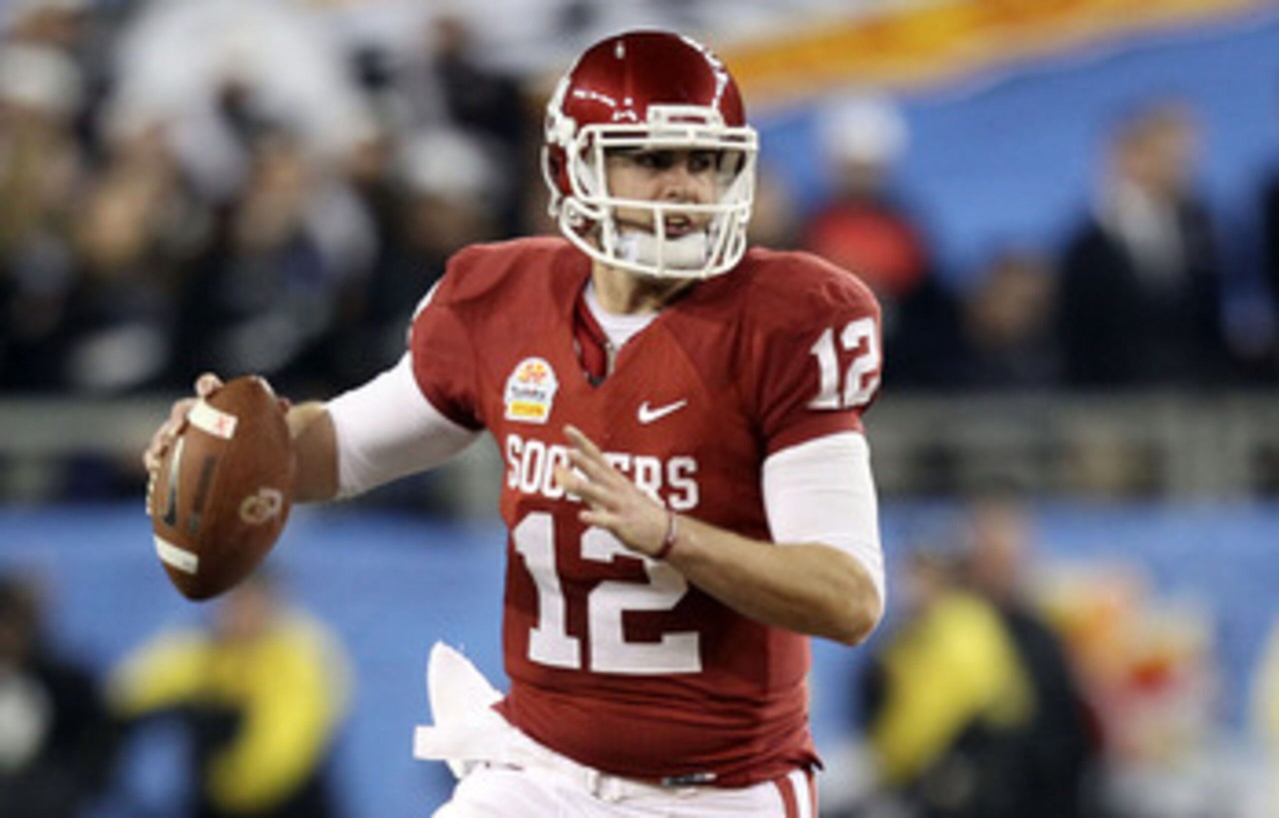 GLENDALE, AZ - JANUARY 01:  Landry Jones #12 of the Oklahoma Sooners throws the ball against the Connecticut Huskies during the Tostitos Fiesta Bowl at the Universtity of Phoenix Stadium on January 1, 2011 in Glendale, Arizona.  (Photo by Christian Peters