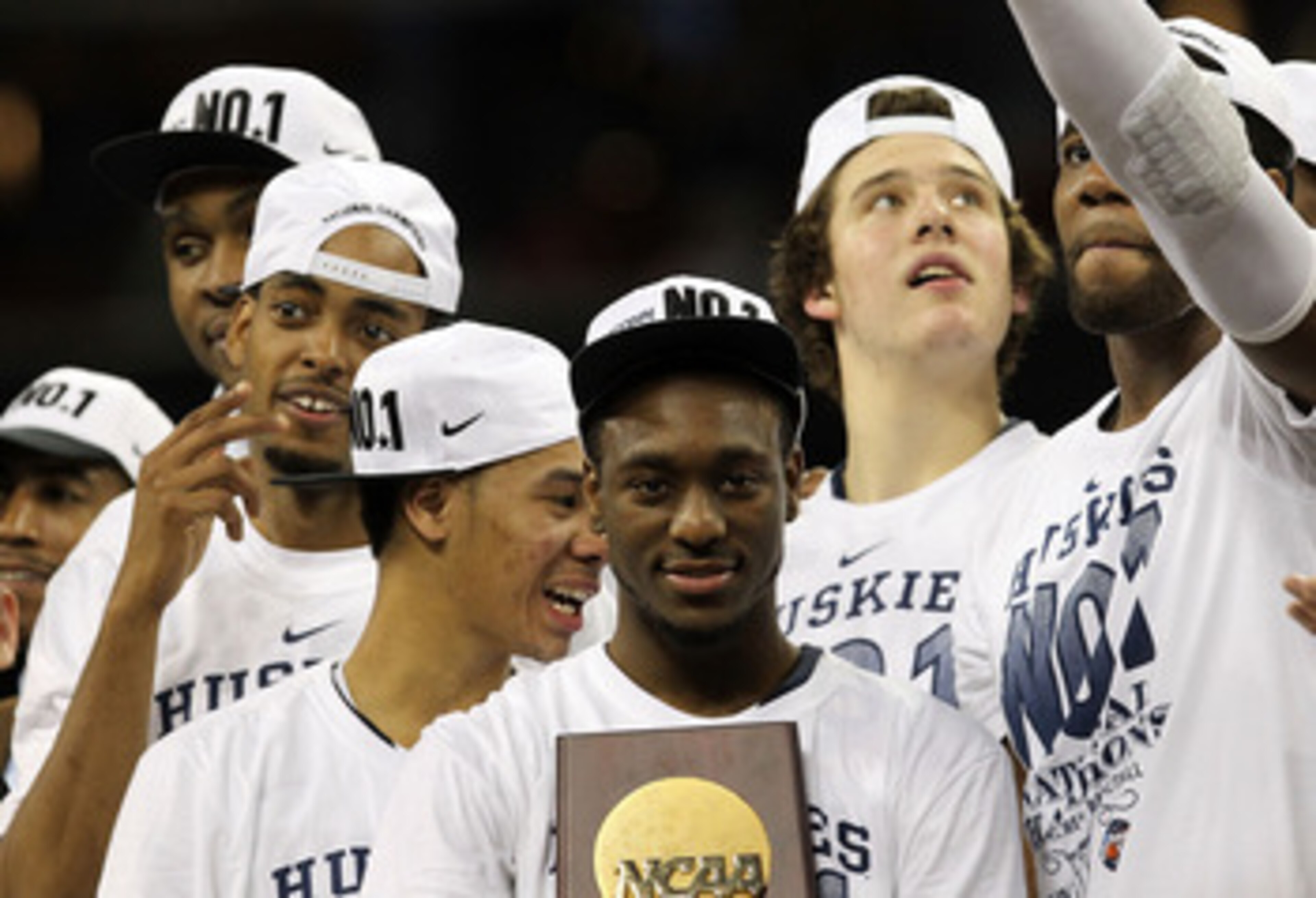 HOUSTON, TX - APRIL 04: Kemba Walker #15 of the Connecticut Huskies holds the trophy as he and his team celebrate after defeating the Butler Bulldogs to win the National Championship Game of the 2011 NCAA Division I Men's Basketball Tournament by a score HOUSTON, TX - APRIL 04: Kemba Walker #15 of the Connecticut Huskies holds the trophy as he and his team celebrate after defeating the Butler Bulldogs to win the National Championship Game of the 2011 NCAA Division I Men's Basketball Tournament by a score
