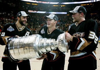ANAHEIM, CA - JUNE 06:  (L-R) Rob Niedermayer #44, Samuel Pahlsson #26 and Travis Moen #32 of the Anaheim Ducks celebrate winning the Stanley Cup after defeating the Ottawa Senators in Game Five of the 2007 Stanley Cup finals on June 6, 2007 at Honda Cent