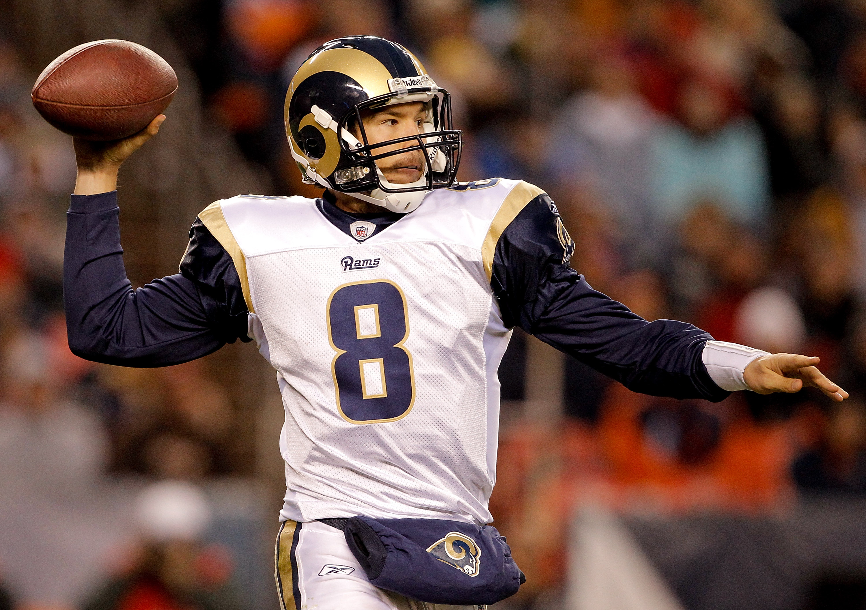 DENVER - NOVEMBER 28:  Quarterback Sam Bradford #8 of the St. Louis Rams makes a pass during the third quarter against the Denver Broncos at INVESCO Field at Mile High on November 28, 2010 in Denver, Colorado. The Rams defeated the Broncos 36-33. (Photo b