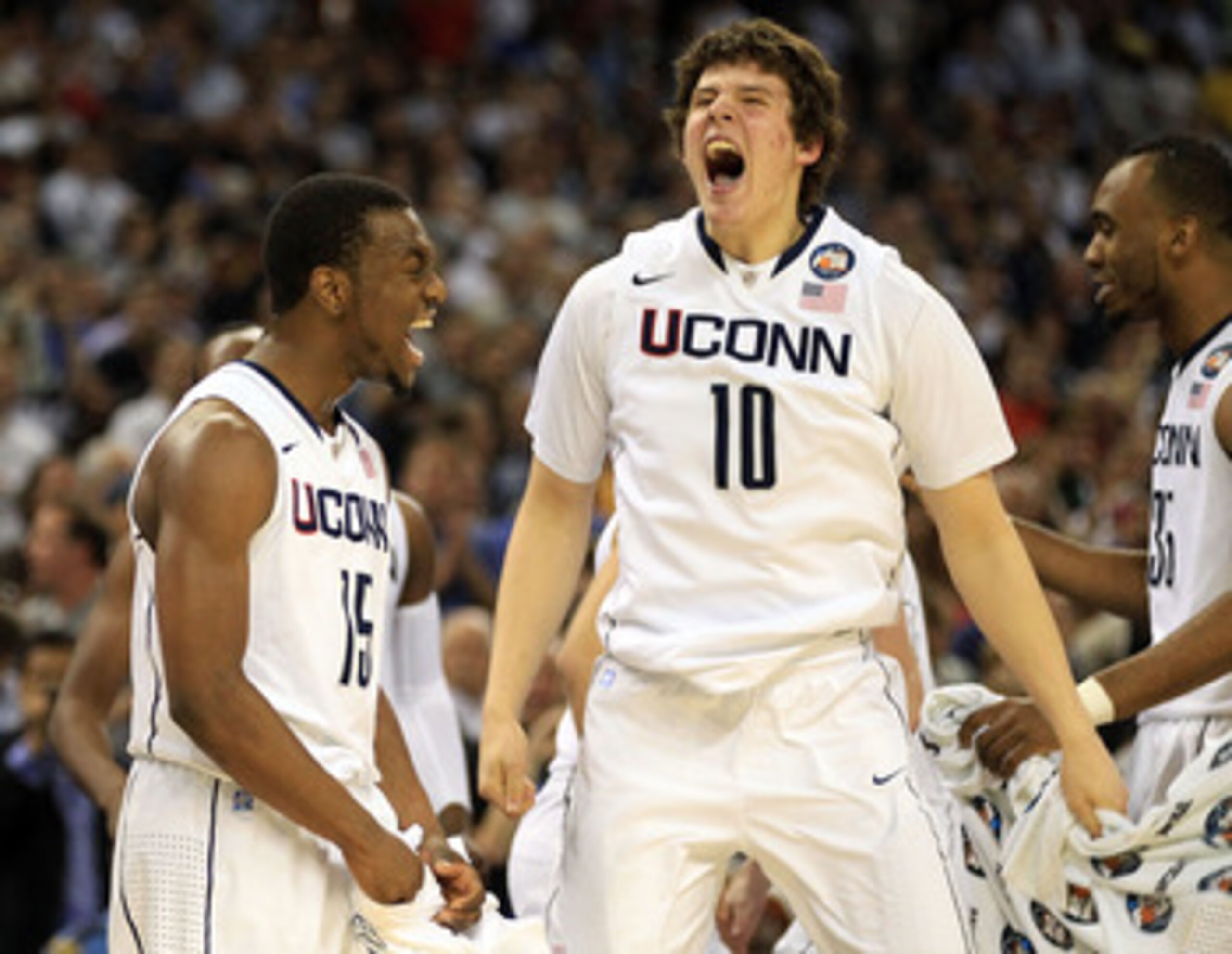 HOUSTON, TX - APRIL 04:  Kemba Walker #15 and Tyler Olander #10 of the Connecticut Huskies react after defeating the Butler Bulldogs to win the National Championship Game of the 2011 NCAA Division I Men's Basketball Tournament by a score of 53-41 at Relia