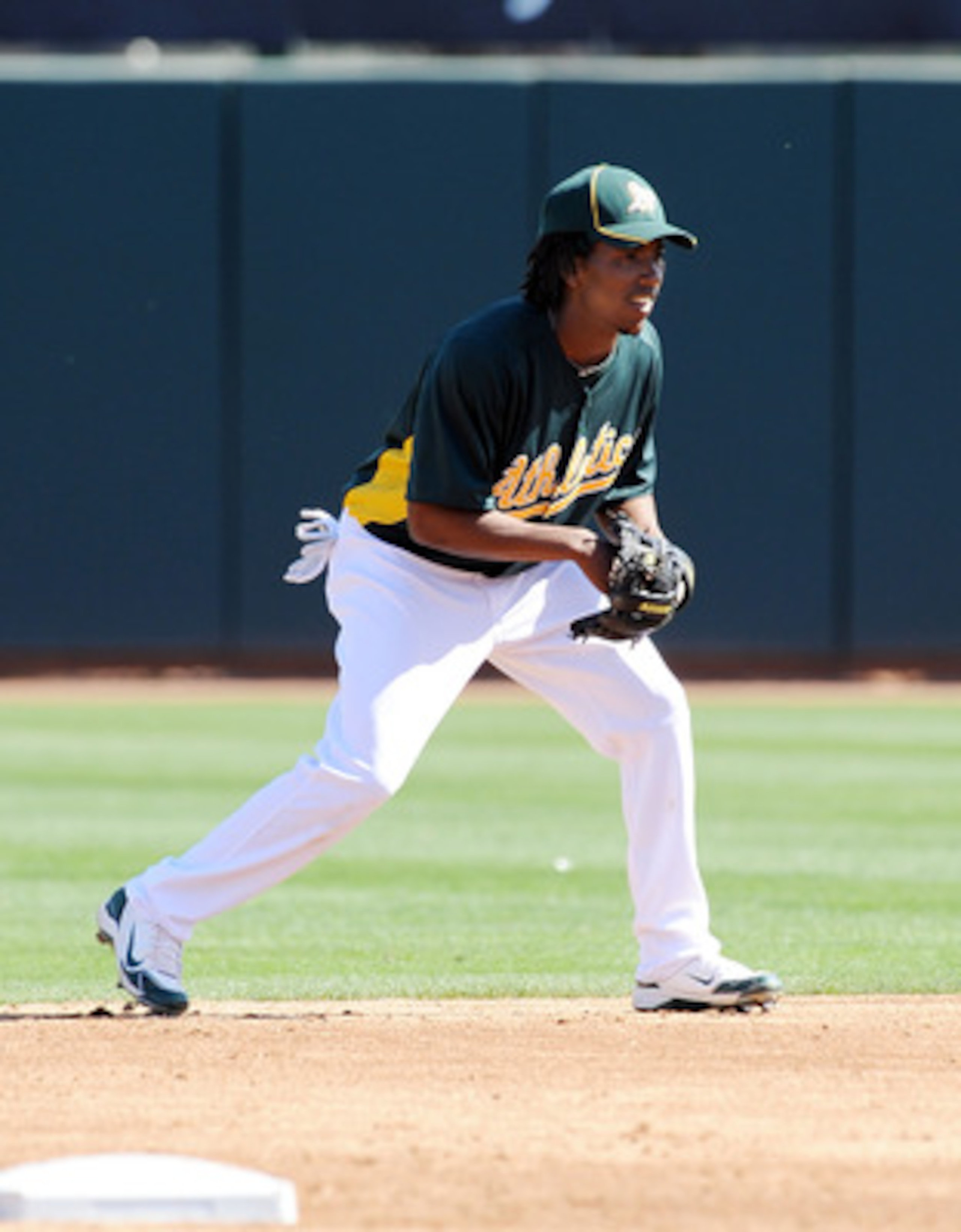 PHOENIX, AZ - MARCH 04:  Jemile Weeks #59 of the Oakland Athletics gets ready at second base against the Texas Rangers at Phoenix Municipal Stadium on March 4, 2011 in Phoenix, Arizona.  (Photo by Norm Hall/Getty Images)