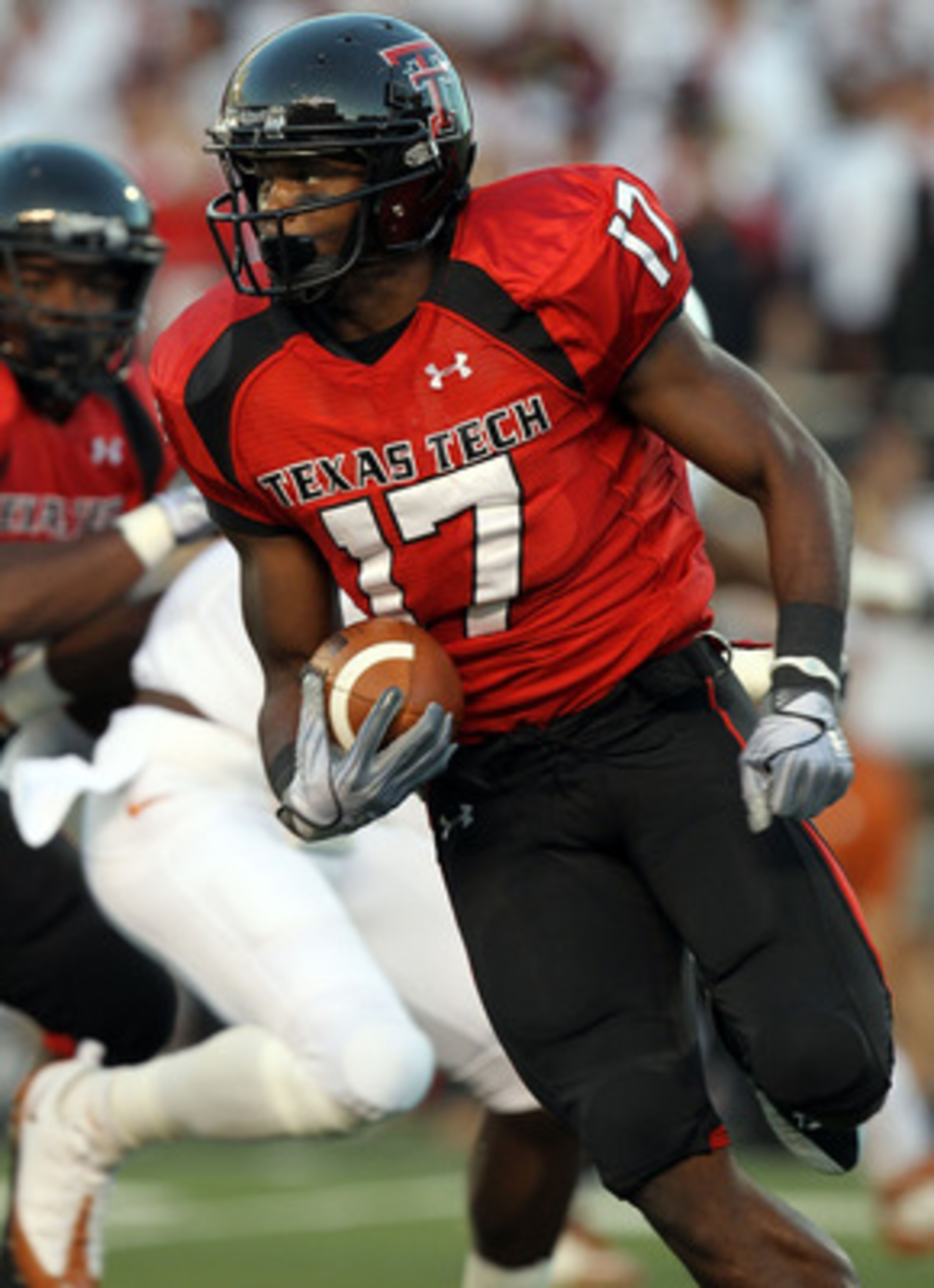 LUBBOCK, TX - SEPTEMBER 18:  Detron Lewis #17 of the Texas Tech Red Raiders runs the ball against the Texas Longhorns at Jones AT&T Stadium on September 18, 2010 in Lubbock, Texas.  (Photo by Ronald Martinez/Getty Images)