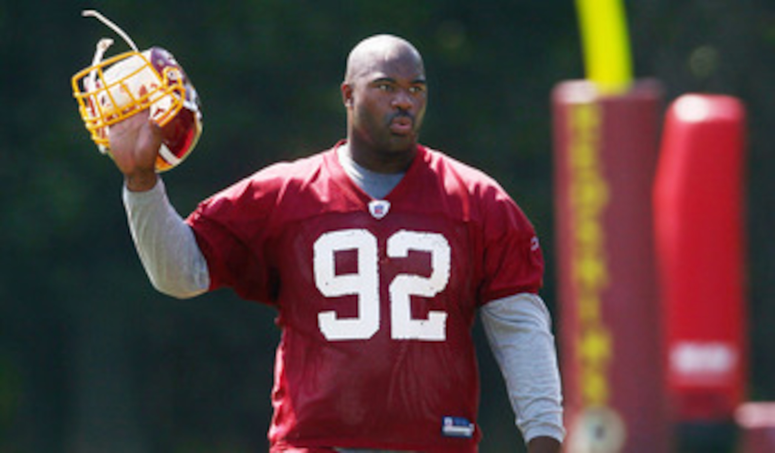 ASHBURN, VA - AUGUST 06:  Defensive lineman Albert Haynesworth #92 of the Washington Redskins walks off the field after missing his eighth consecutive day of practice during Redskins training camp on August 6, 2010 in Ashburn, Virginia.  (Photo by Win McN
