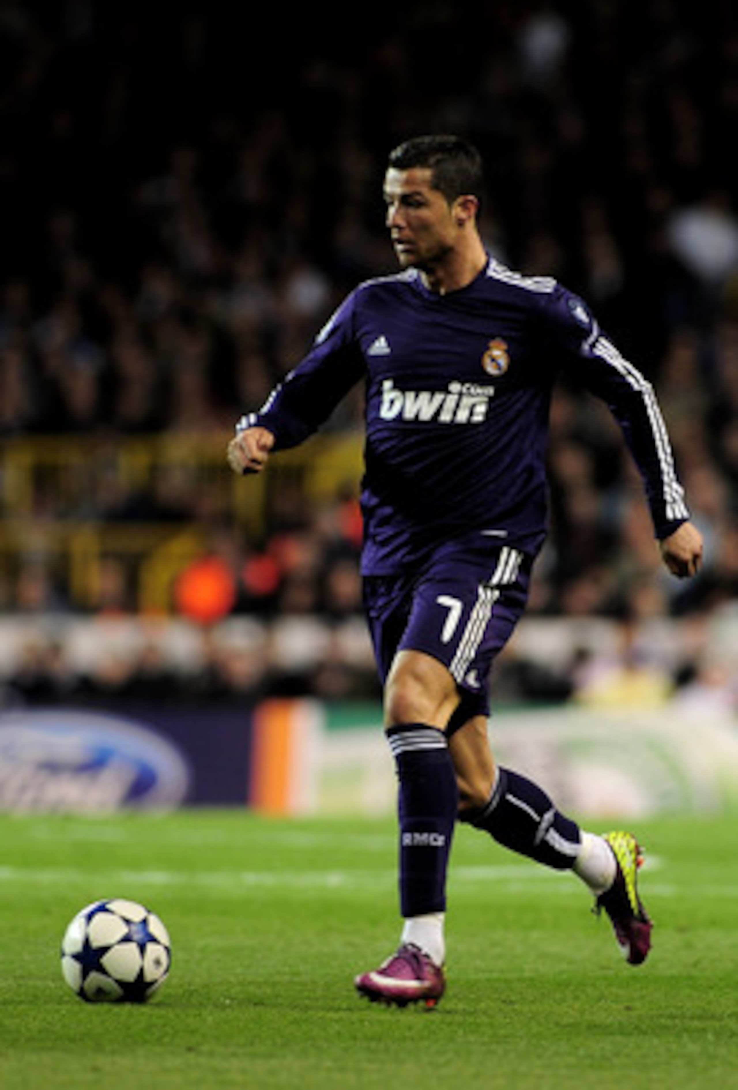 LONDON, ENGLAND - APRIL 13: Cristiano Ronaldo of Real Madrid runs with the ball during the UEFA Champions League quarter final second leg match between Tottenham Hotspur and Real Madrid at White Hart Lane on April 13, 2011 in London, England.  (Photo by S