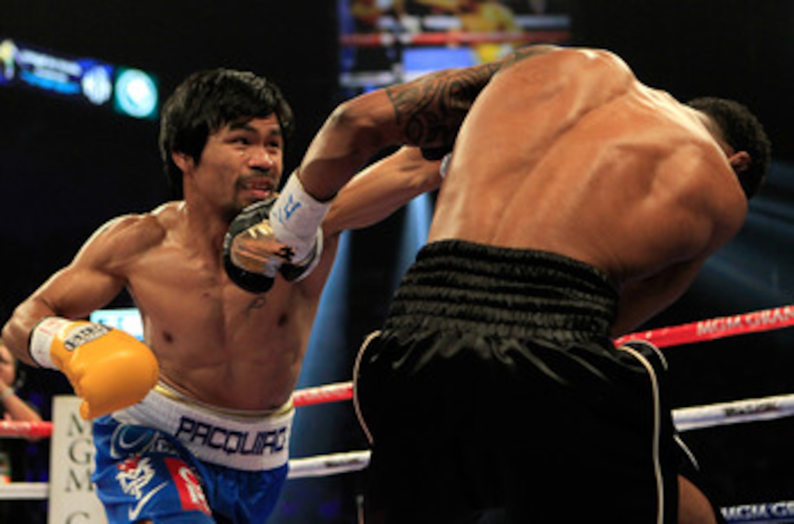 LAS VEGAS, NV - MAY 07:  (L-R) Manny Pacquiao of the Philippines throws a left at Shane Mosley in the WBO welterweight title fight at MGM Grand Garden Arena on May 7, 2011 in Las Vegas, Nevada.  (Photo by Chris Trotman/Getty Images)