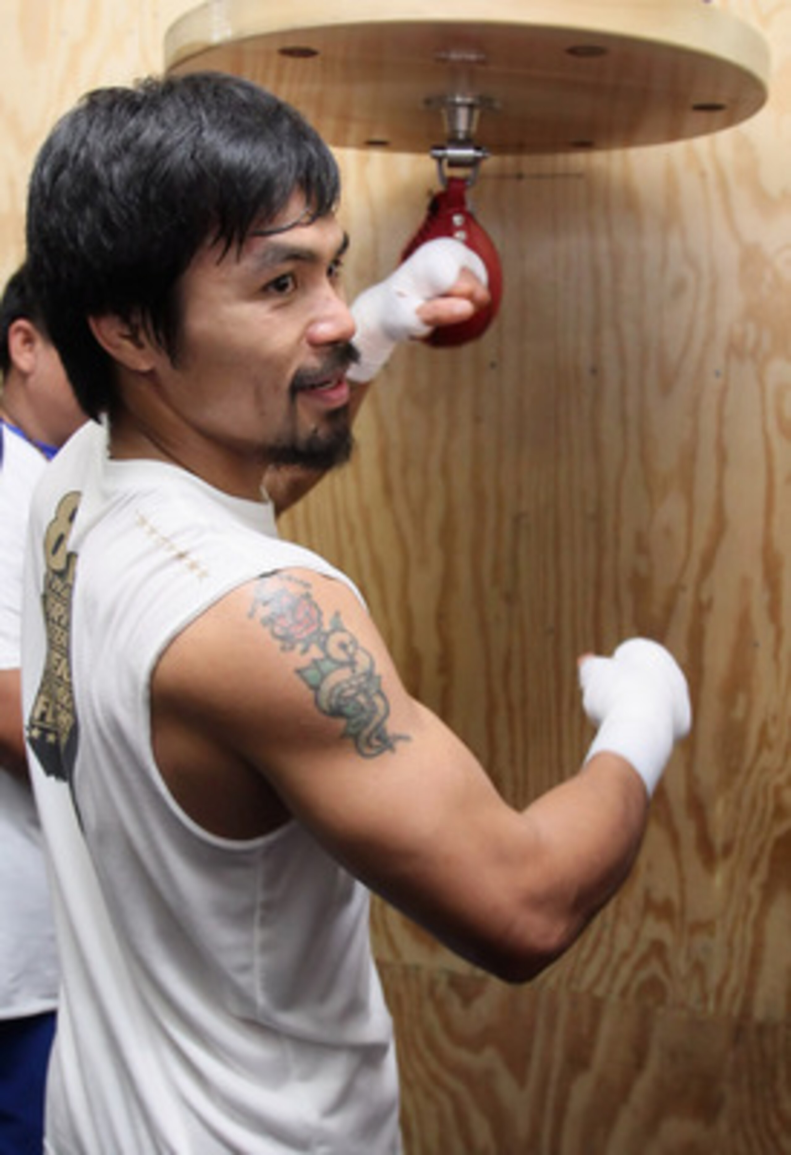 HOLLYWOOD, CA - APRIL 20:  Manny Pacquiao of the Philippines trains on the speed bag during a media workout at the Wild Card Boxing Club on April 20, 2011 in Hollywood, California.  (Photo by Jeff Gross/Getty Images)