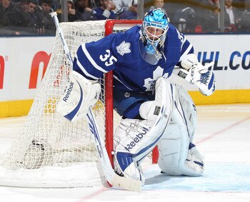TORONTO, CANADA - FEBRUARY 07:  JS Giguere #35 of the Toronto Maple Leafs protects the corner in a game against the Atlanta Thrashers on February 7, 2011 at the Air Canada Centre in Toronto, Canada. The Leafs defeated the Thrashers 5-4. (Photo by Claus An