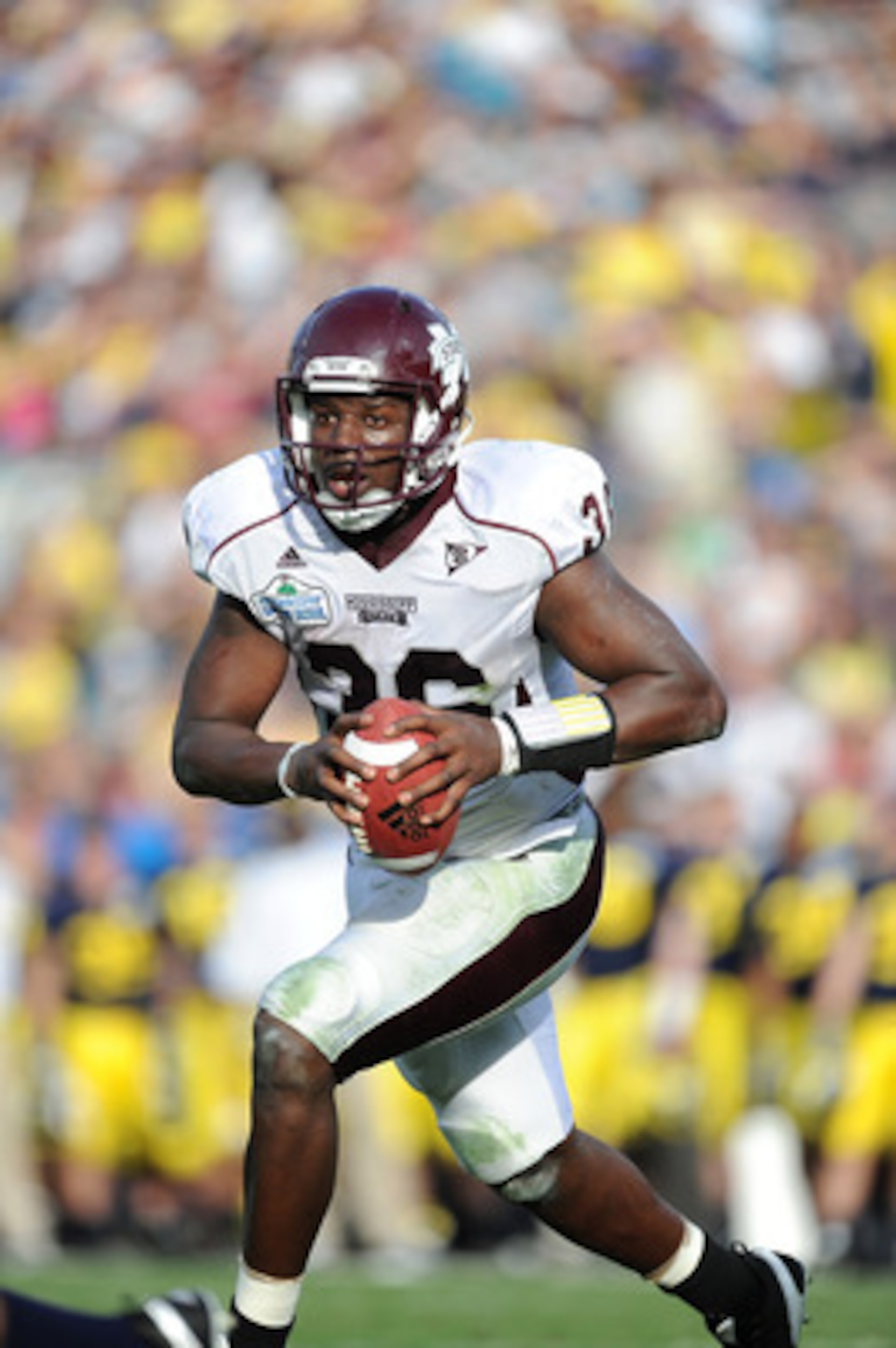 JACKSONVILLE, FL - JANUARY 01:  Quarterback Chris Relf #36 of the Mississippi State Bulldogs rushes against the Michigan Wolverines during the Gator Bowl at EverBank Field on January 1, 2011 in Jacksonville, Florida  (Photo by Rick Dole/Getty Images)
