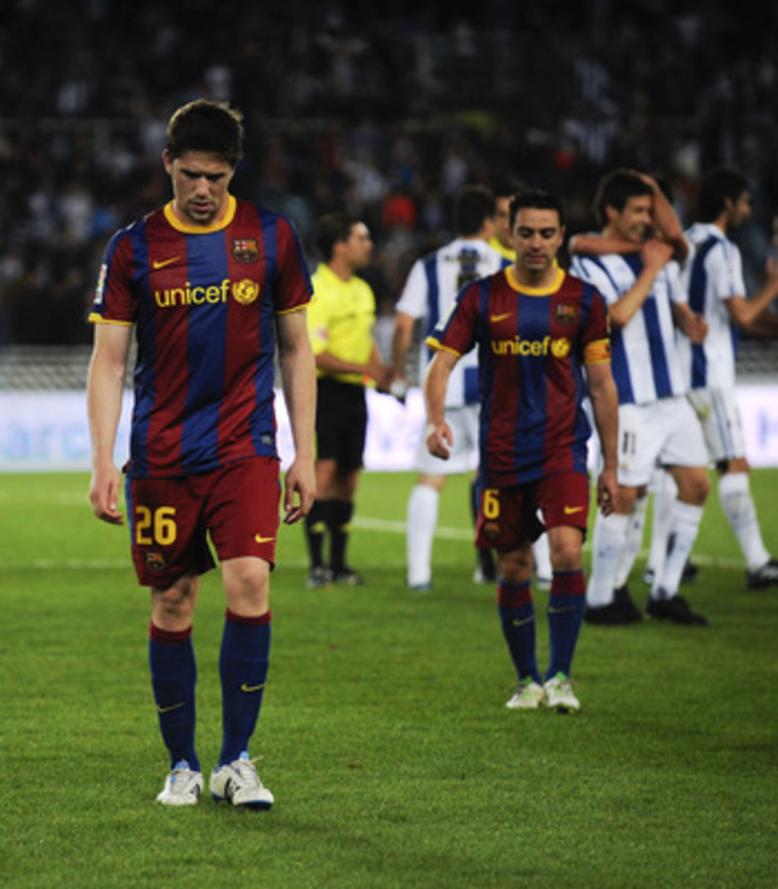 SAN SEBASTIAN, SPAIN - APRIL 30:  Fontas (L) and Xavi Hernandez of FC Barcelona look down dejected at the end of the La Liga match between Real Sociedad and Barcelona at Estadio Anoeta on April 30, 2011 in San Sebastian, Spain. Real Sociedad won 2-1.  (Ph