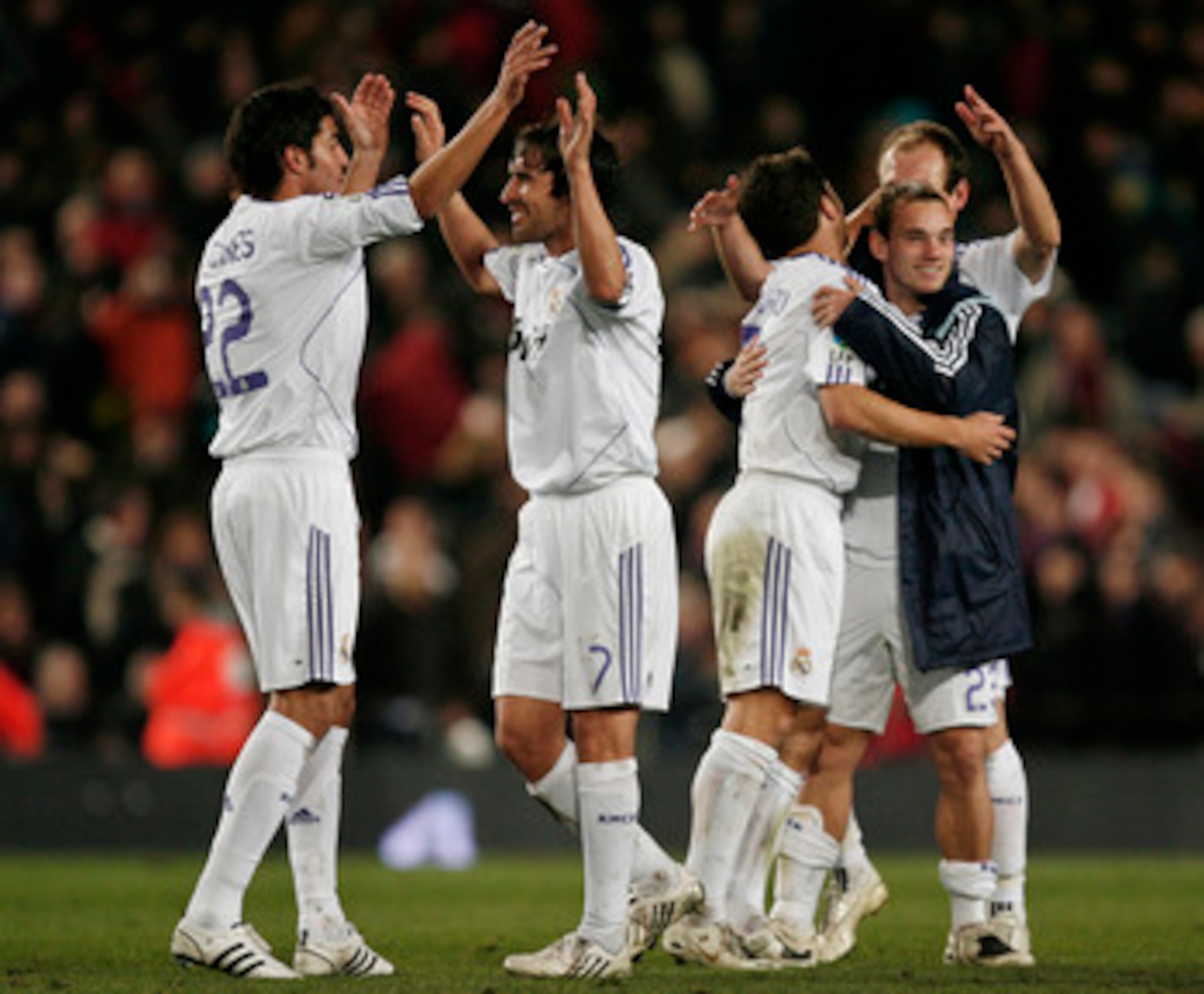 BARCELONA, SPAIN - DECEMBER 23:  Raul Gonzalez (2nd L) and Miguel Torres of Real Madrid celebrate with other teammates their win over Barcelona at the end of the La Liga match between Barcelona and Real Madrid at the Camp Nou Stadium on December 23, 2007 