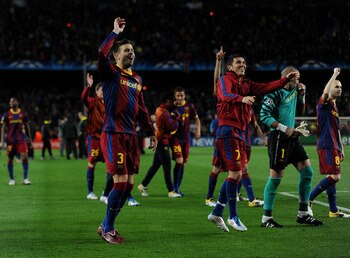 BARCELONA, SPAIN - MAY 03:  Gerard Pique (L) and David Villa of Barcelona celebrate with their teammates at the end of the UEFA Champions League Semi Final second leg match between Barcelona and Real Madrid at the Camp Nou stadium on May 3, 2011 in Barcel