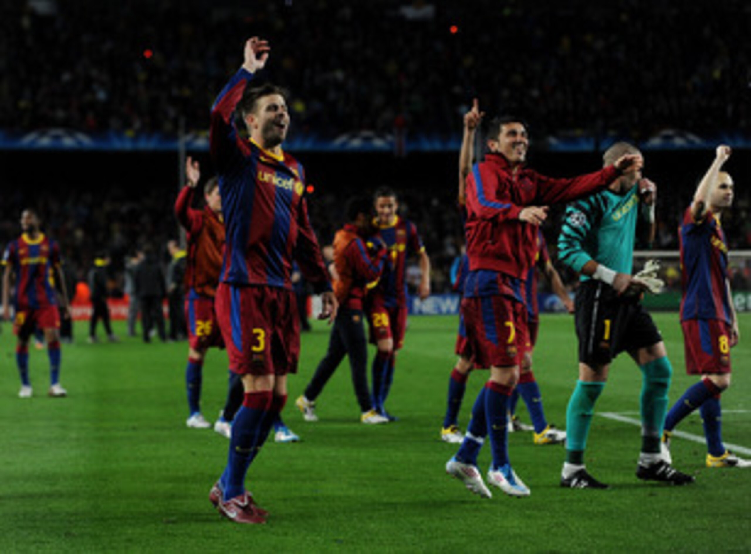 BARCELONA, SPAIN - MAY 03:  Gerard Pique (L) and David Villa of Barcelona celebrate with their teammates at the end of the UEFA Champions League Semi Final second leg match between Barcelona and Real Madrid at the Camp Nou stadium on May 3, 2011 in Barcel