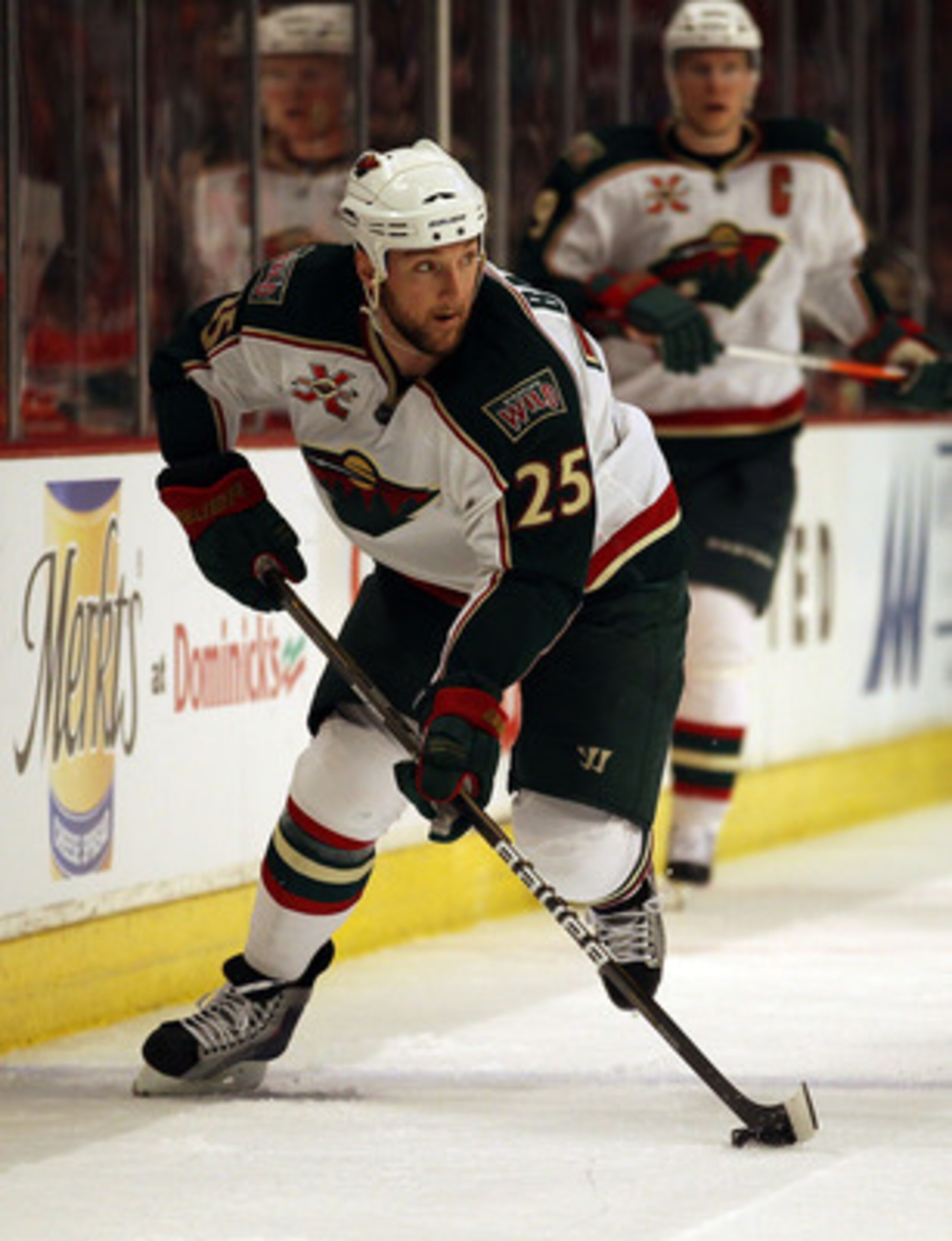 CHICAGO, IL - FEBRUARY 16: Cam Barker #25 of the Minnesota Wild looks to pass against the Chicago Blackhawks at the United Center on February 16, 2011 in Chicago, Illinois. The Blackhawks defeated the Wild 3-1. (Photo by Jonathan Daniel/Getty Images)