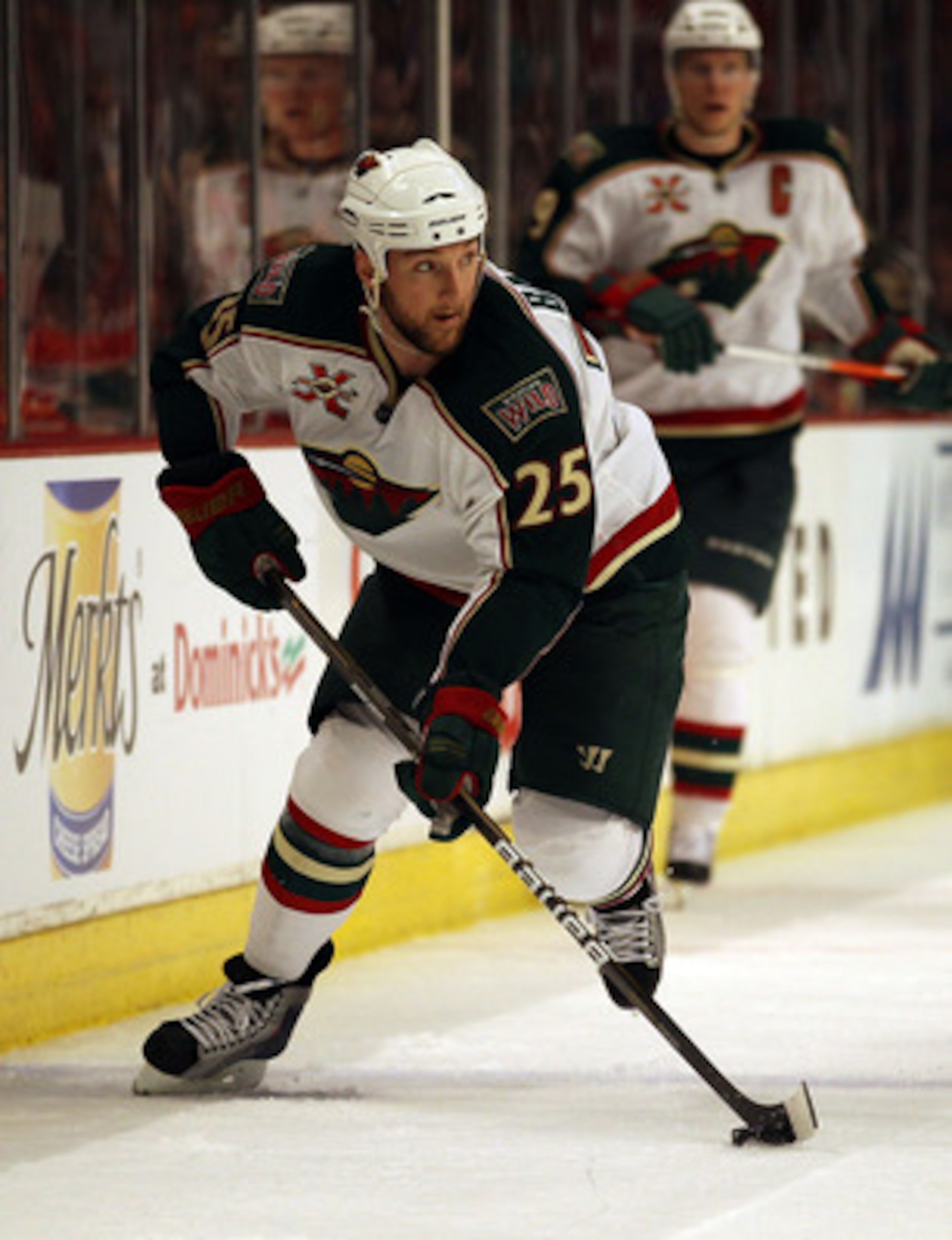 CHICAGO, IL - FEBRUARY 16: Cam Barker #25 of the Minnesota Wild looks to pass against the Chicago Blackhawks at the United Center on February 16, 2011 in Chicago, Illinois. The Blackhawks defeated the Wild 3-1. (Photo by Jonathan Daniel/Getty Images)