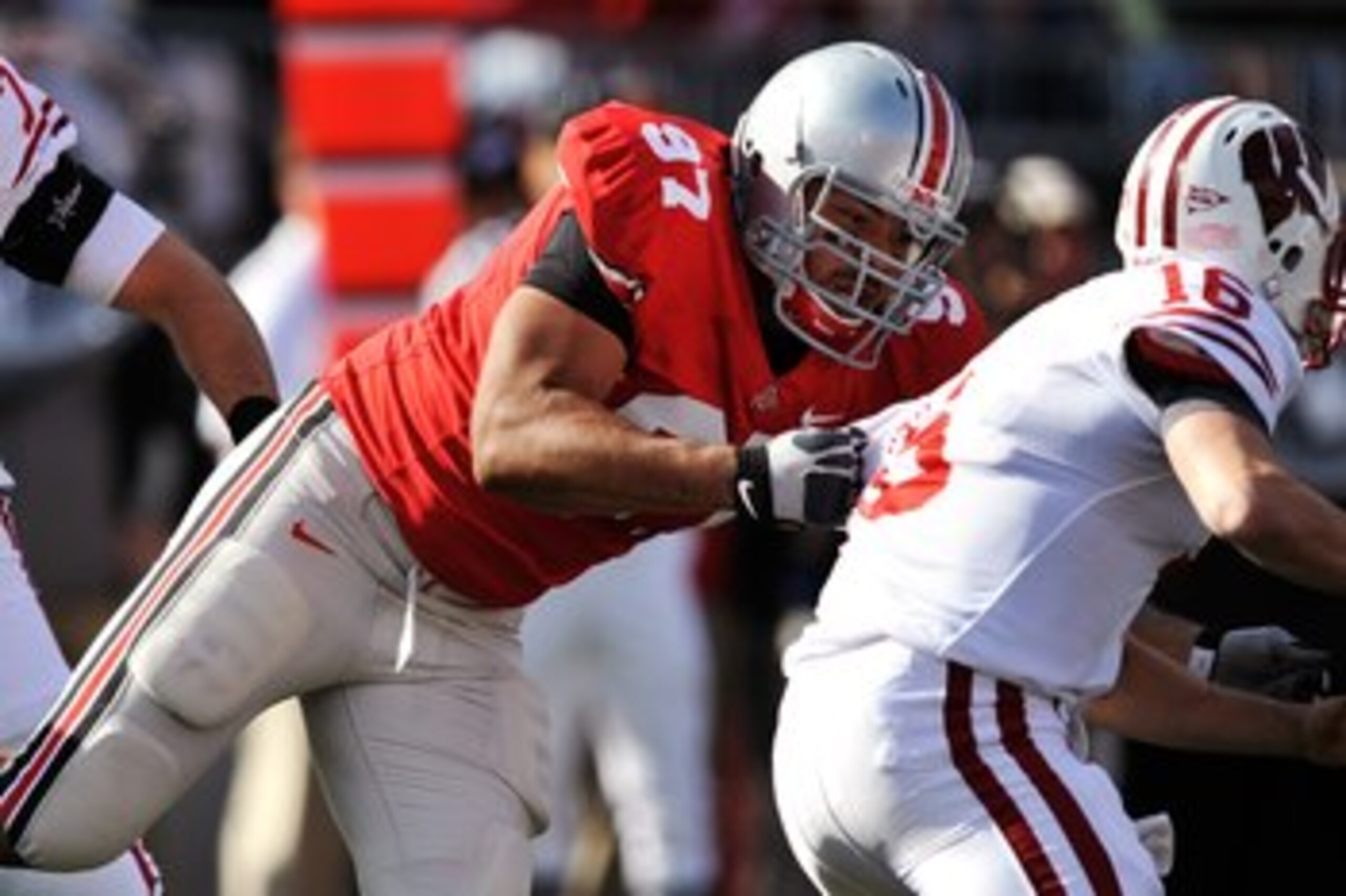 COLUMBUS, OH - OCTOBER 10:  Defensive lineman Cameron Heyward #97of the Ohio State Buckeyes makes a tackle on quarterback Scott Tolzien #16 of the Wisconsin Badgers at Ohio Stadium on October 10, 2009 in Columbus, Ohio.  (Photo by Jamie Sabau/Getty Images