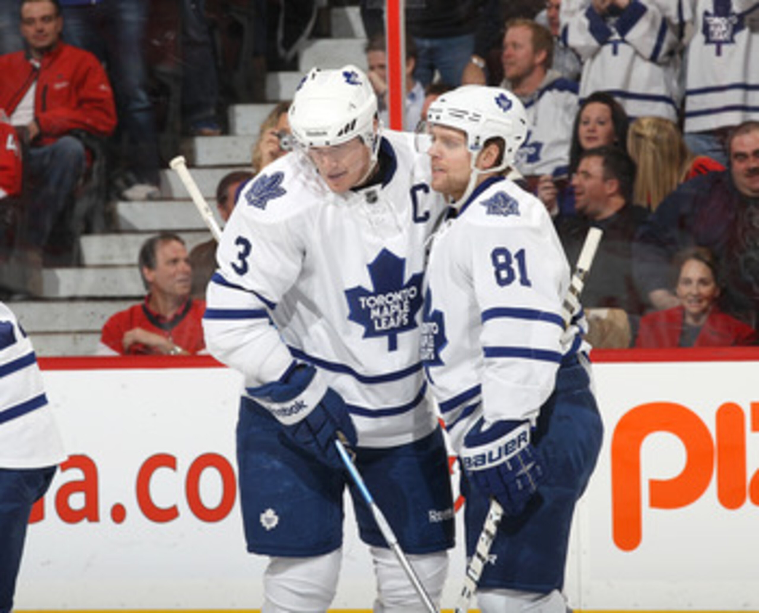 OTTAWA, CANADA - APRIL 2: Phil Kessel #81 of the Toronto Maple Leafs celebrates his goal with teammate Dion Phaneuf #3 in a game against the Ottawa Senators at Scotiabank Place on April 2, 2011 in Ottawa, Ontario, Canada.  (Photo by Jana Chytilova/Freesty