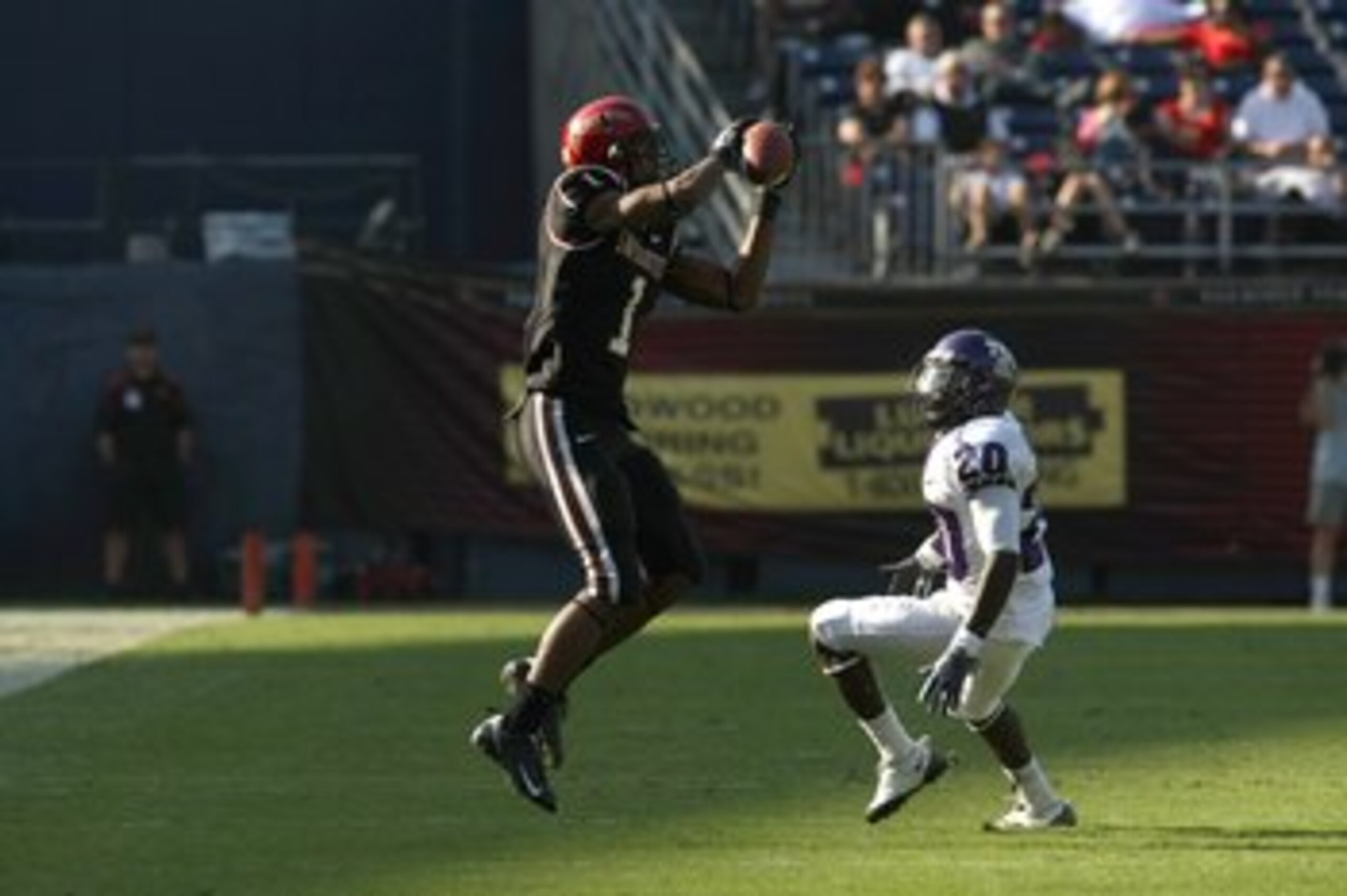 SAN DIEGO - NOVEMBER 07:  Wide receiver DeMarco Sampson #1 of  the San Diego State Aztecs makes a catch against cornerback Nick Sanders #20 ofthe Texas Christian University Horned Frogs on November 7, 2009 at Qualcomm Stadium in San Diego, California.   T