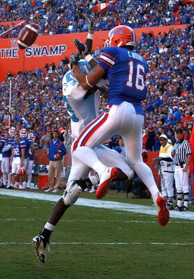 GAINESVILLE, FL - NOVEMBER 22:  Carl Moore #16 of the Florida Gators catches a pass against Cortez Allen #13 of the Citadel Bulldogs during the game at Ben Hill Griffin Stadium on November 22, 2008 in Gainesville, Florida.  (Photo by Sam Greenwood/Getty I
