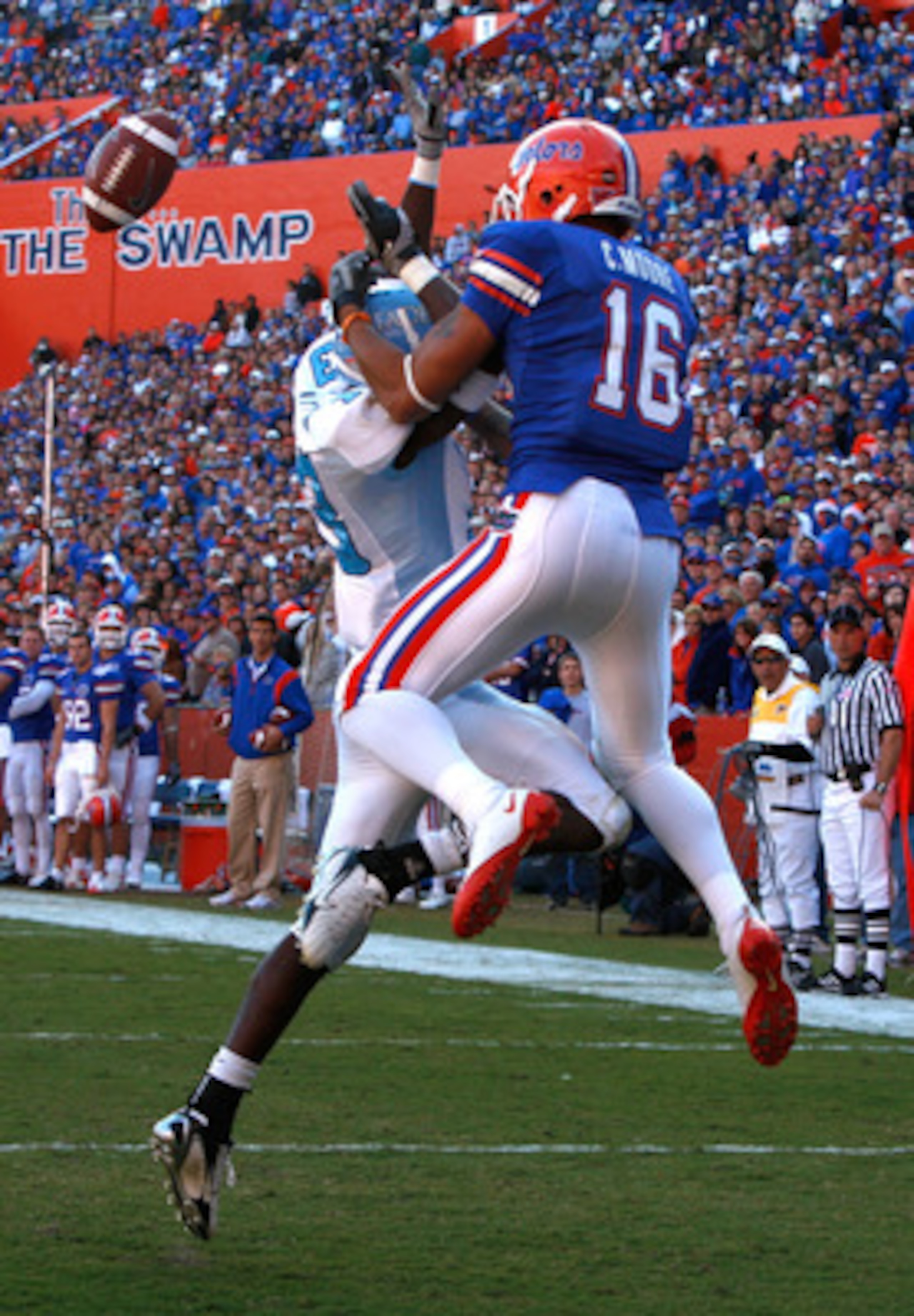 GAINESVILLE, FL - NOVEMBER 22:  Carl Moore #16 of the Florida Gators catches a pass against Cortez Allen #13 of the Citadel Bulldogs during the game at Ben Hill Griffin Stadium on November 22, 2008 in Gainesville, Florida.  (Photo by Sam Greenwood/Getty I