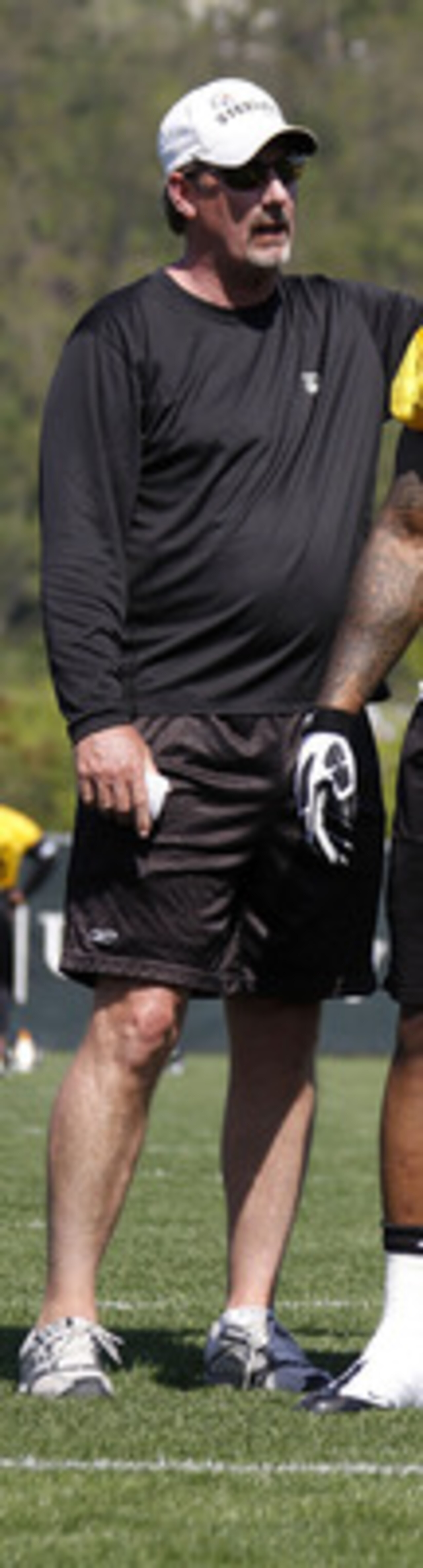 PITTSBURGH - APRIL 30: Thaddeus Gibson #90 of the Pittsburgh Steelers listens to Keith Butler the Linebackers coach during mini camp at the Pittsburgh Steelers Training Facility on April 30, 2010 in Pittsburgh, Pennsylvania.  (Photo by Gregory Shamus/Gett