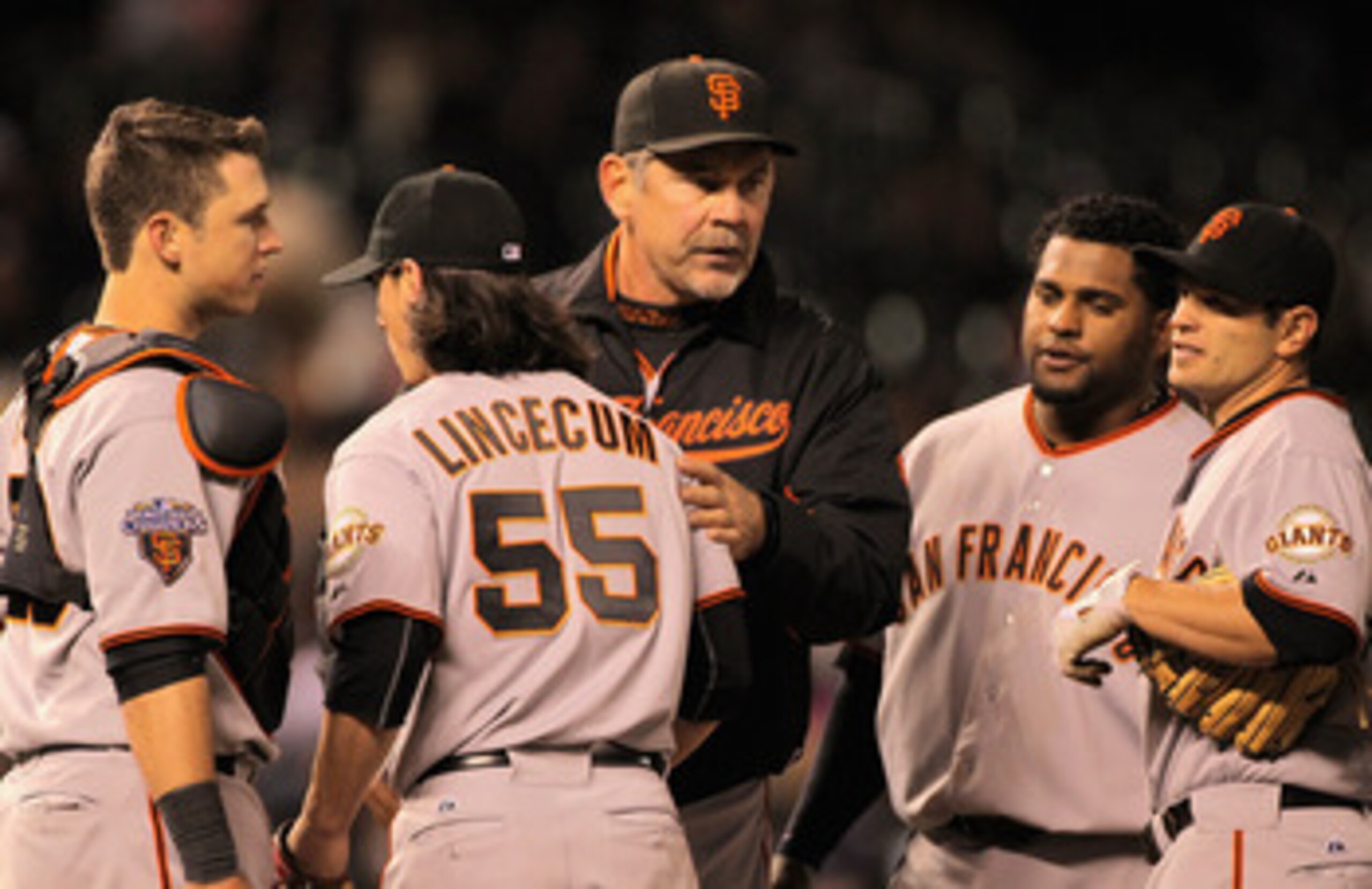 DENVER, CO - APRIL 18:  Manager Bruce Bochy #15 of the San Francisco Giants removes starting pitcher Tim Lincecum #55 of the San Francisco Giants from the game in the eighth inning at Coors Field on April 18, 2011 in Denver, Colorado. Lincecum earned the