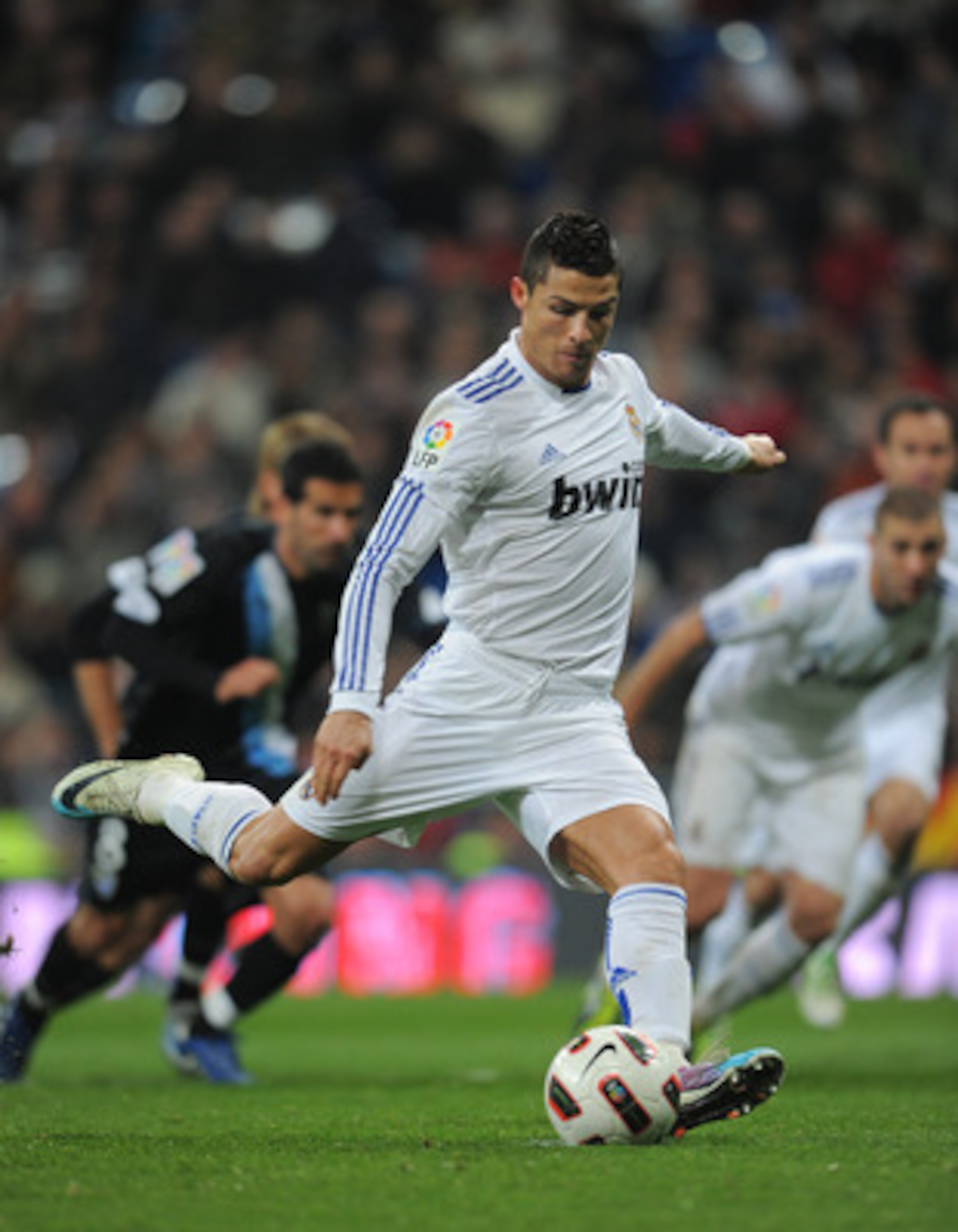 MADRID, SPAIN - MARCH 03: Cristiano Ronaldo of Real Madrid strikes to score from the penalty spot during the la Liga match between Real Madrid and Malaga at Estadio Santiago Bernabeu on March 3, 2011 in Madrid, Spain. (Photo by Jasper Juinen/Getty Image MADRID, SPAIN - MARCH 03: Cristiano Ronaldo of Real Madrid strikes to score from the penalty spot during the la Liga match between Real Madrid and Malaga at Estadio Santiago Bernabeu on March 3, 2011 in Madrid, Spain. (Photo by Jasper Juinen/Getty Image