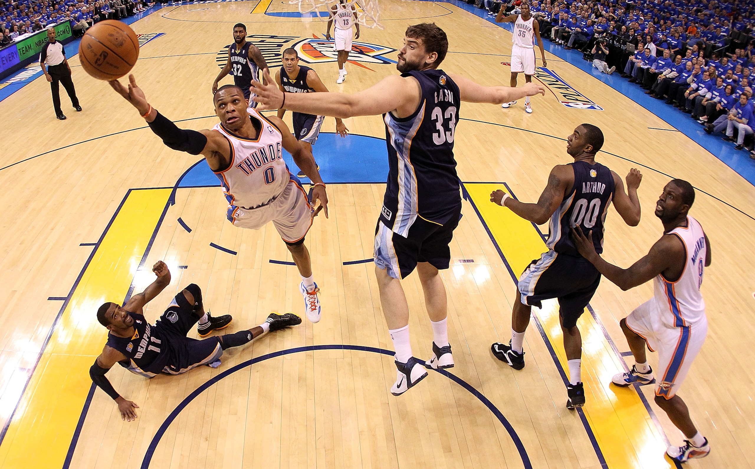 OKLAHOMA CITY, OK - MAY 03:  Guard Russell Westbrook #0 of the Oklahoma City Thunder takes a shot against Marc Gasol #33 of the Memphis Grizzlies in Game Two of the Western Conference Semifinals in the 2011 NBA Playoffs on May 3, 2011 at Oklahoma City Are