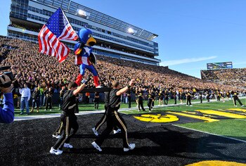 IOWA CITY, IA - OCTOBER 30- Dressed as Captain American Univeristy of Iowa mascot Herky the Hawk takes the field for the Michigan State Spartans NCAA football game at Kinnick Stadium on October 30, 2010 in Iowa City, Iowa. Iowa won 37-6 over Michigan Stat