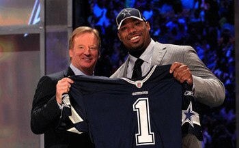 NEW YORK, NY - APRIL 28:  NFL Commissioner Roger Goodell (L) poses for a photo with Tyron Smith, #9 overall pick by the Dallas Cowboys, on stage during the 2011 NFL Draft at Radio City Music Hall on April 28, 2011 in New York City.  (Photo by Chris Trotma