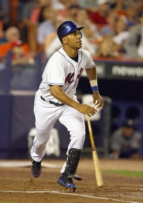 NEW YORK - SEPTEMBER 26: Moises Alou #18 of the New York Mets hits a two run home run in the first inning off of Mike Bacsik of the Washington Nationals during their game at Shea Stadium on September 26, 2007 in the Queens borough of the Flushing neighbor