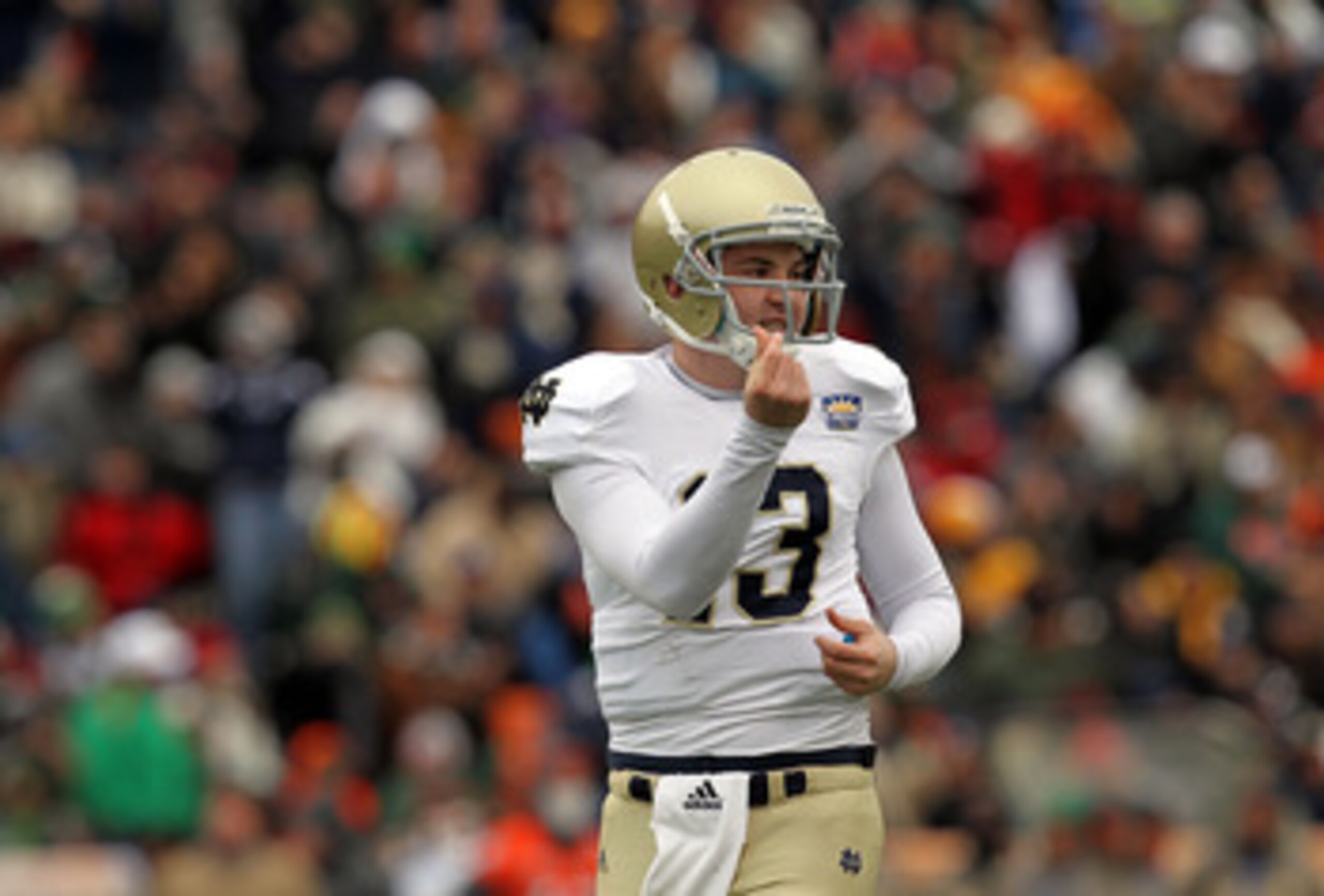 EL PASO, TX - DECEMBER 30: Quarterback Tommy Rees #13 of the Notre Dame Fighting Irish celebrates a touchdown against the Miami Hurricanes at Sun Bowl on December 30, 2010 in El Paso, Texas. (Photo by Ronald Martinez/Getty Images) EL PASO, TX - DECEMBER 30: Quarterback Tommy Rees #13 of the Notre Dame Fighting Irish celebrates a touchdown against the Miami Hurricanes at Sun Bowl on December 30, 2010 in El Paso, Texas. (Photo by Ronald Martinez/Getty Images)