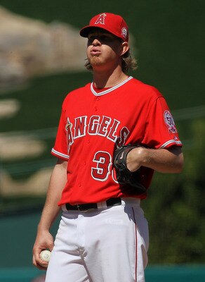 ANAHEIM, CA - APRIL 10:  Jered Weaver #36 of the Los Angeles Angels of Anaheim reacts on the mound as he waits to be relieved in the eighth inning after recording his 15th strikeout against the Toronto Blue Jays on April 10, 2011 at Angel Stadium in Anahe