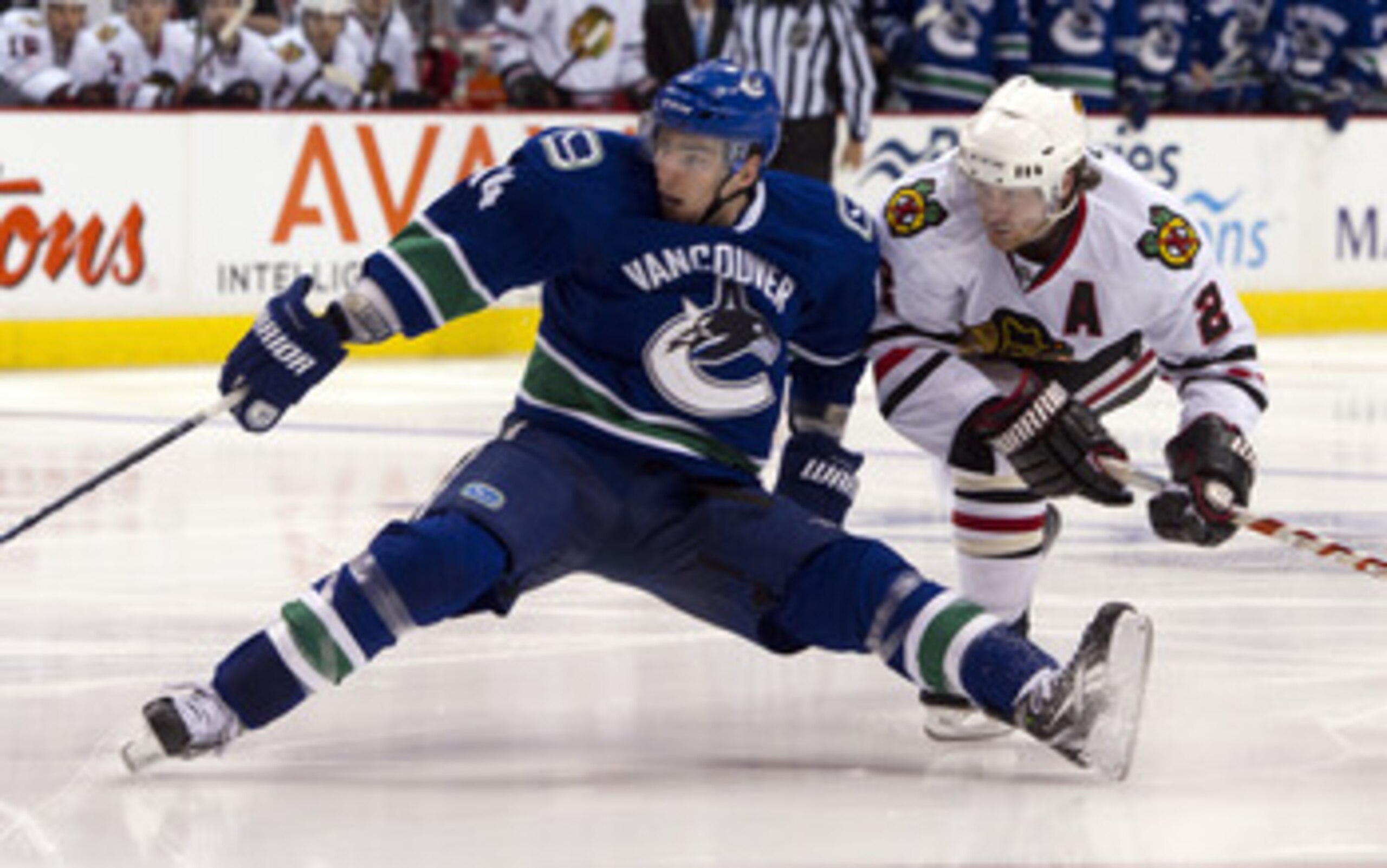 VANCOUVER, CANADA - APRIL 26: Duncan Keith #2 of the Chicago Blackhawks hauls down Alexandre Burrows #14 of the Vancouver Canucks during the third period in Game Seven of the Western Conference Quarterfinals during the 2011 NHL Stanley Cup Playoffs on Apr
