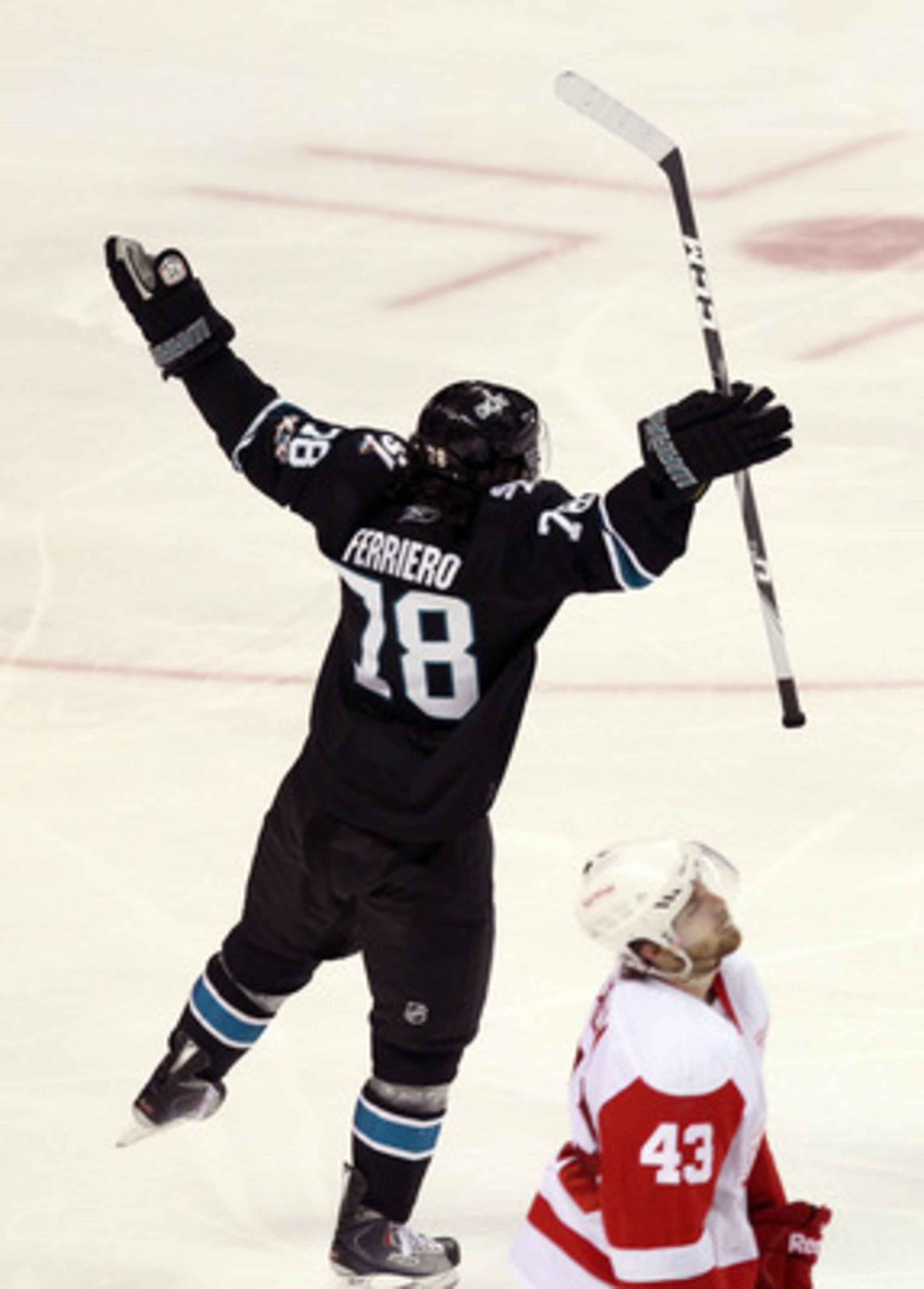 SAN JOSE, CA - APRIL 29:  Benn Ferriero #78 of the San Jose Sharks celebrates in front of Darren Helm #43 of the Detroit Red Wings after he made the winning goal in overtime of Game One of the Western Conference Semifinals during the 2011 NHL Stanley Cup 