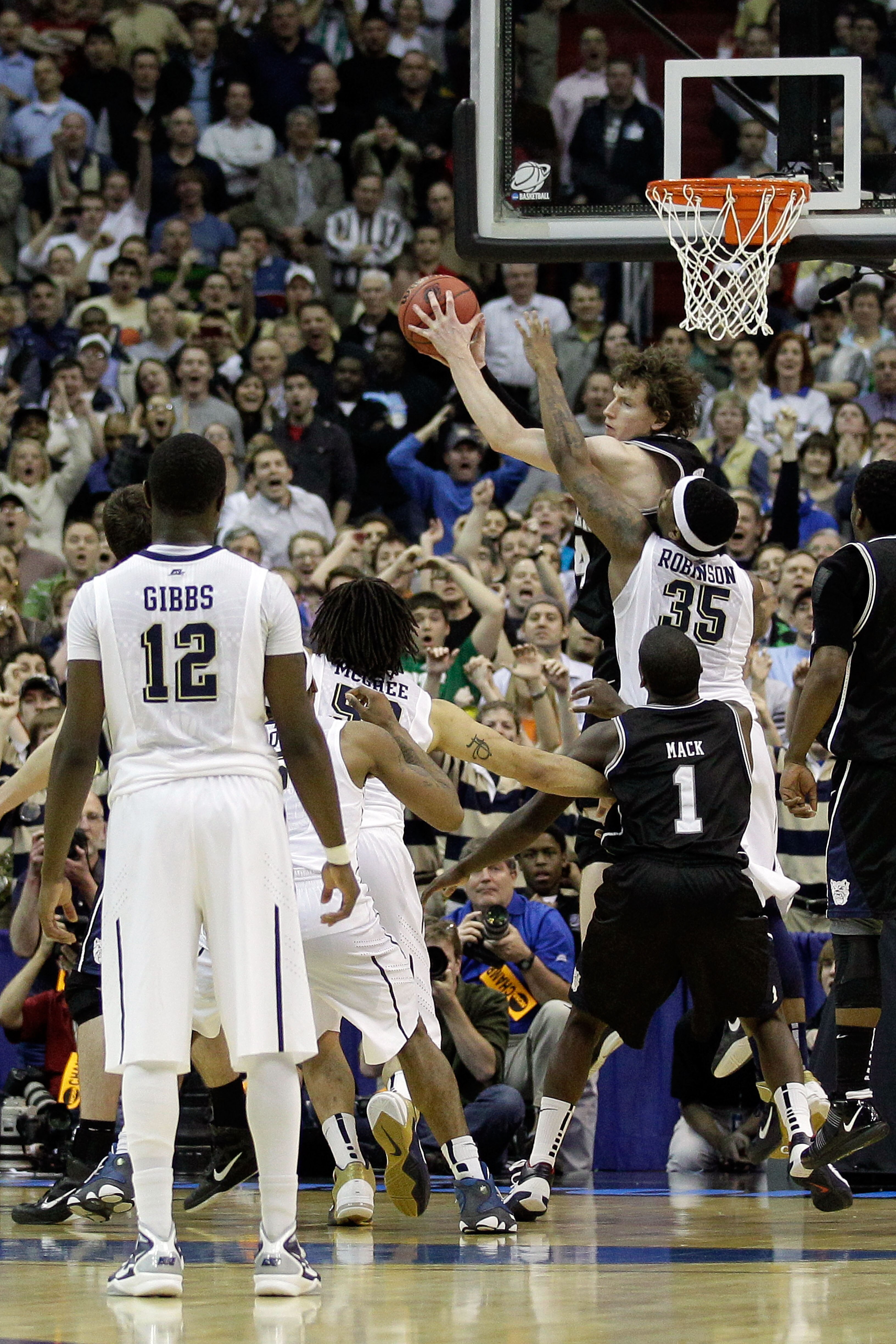 WASHINGTON - MARCH 19:  Nasir Robinson #35 of the Pittsburgh Panthers fouls Matt Howard #54 of the Butler Bulldogs in the last second during the third round of the 2011 NCAA men's basketball tournament at Verizon Center on March 19, 2011 in Washington, DC