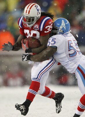 FOXBORO, MA - OCTOBER 18:  Laurence Maroney #39 of the New England Patriots is tackled Stephen Tulloch #55 of the Tennessee Titans on October 18, 2009 at Gillette Stadium in Foxboro, Massachusetts. The Patriots defeated the Titans 59-0.  (Photo by Elsa/Ge