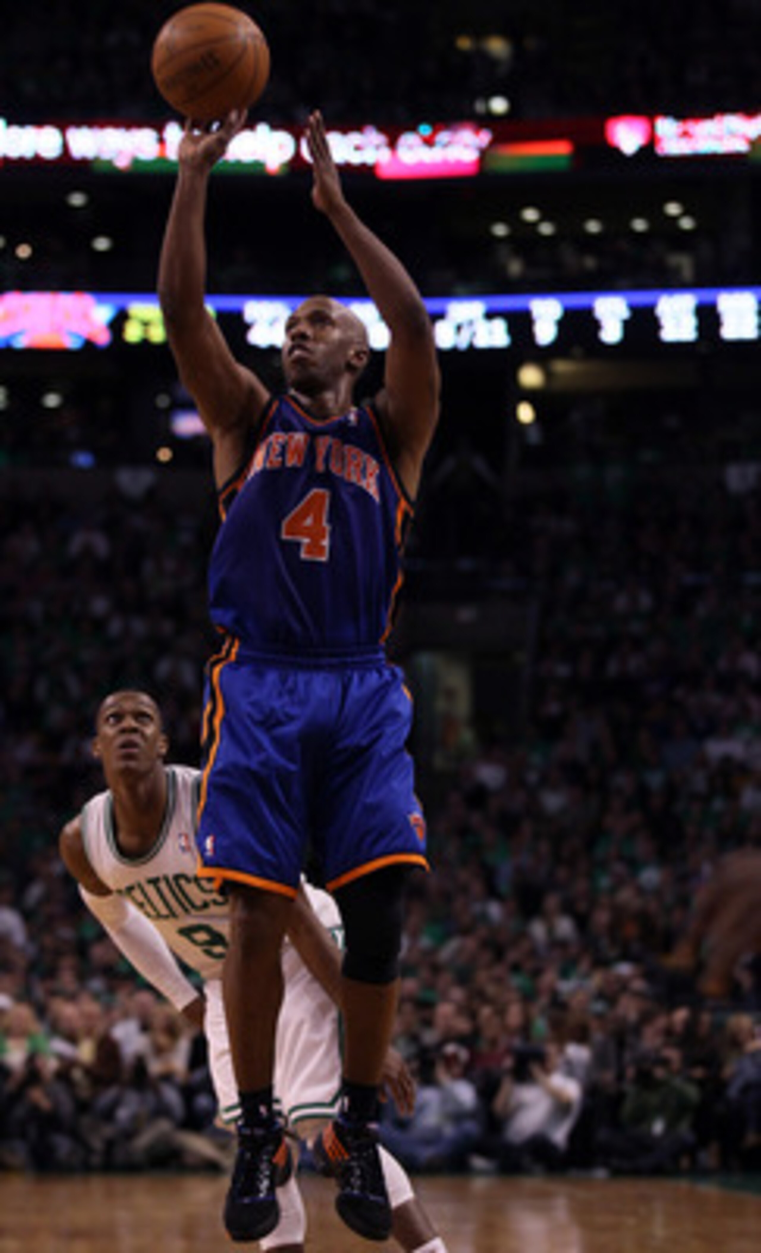 BOSTON, MA - APRIL 17: Chauncey Billups #4 of the New York Knicks takes a shot as Rajon Rondo #9 of the Boston Celtics defends in Game One of the Eastern Conference Quarterfinals in the 2011 NBA Playoffs on April 17, 2011 at the TD Garden in Boston, Mass BOSTON, MA - APRIL 17: Chauncey Billups #4 of the New York Knicks takes a shot as Rajon Rondo #9 of the Boston Celtics defends in Game One of the Eastern Conference Quarterfinals in the 2011 NBA Playoffs on April 17, 2011 at the TD Garden in Boston, Mass
