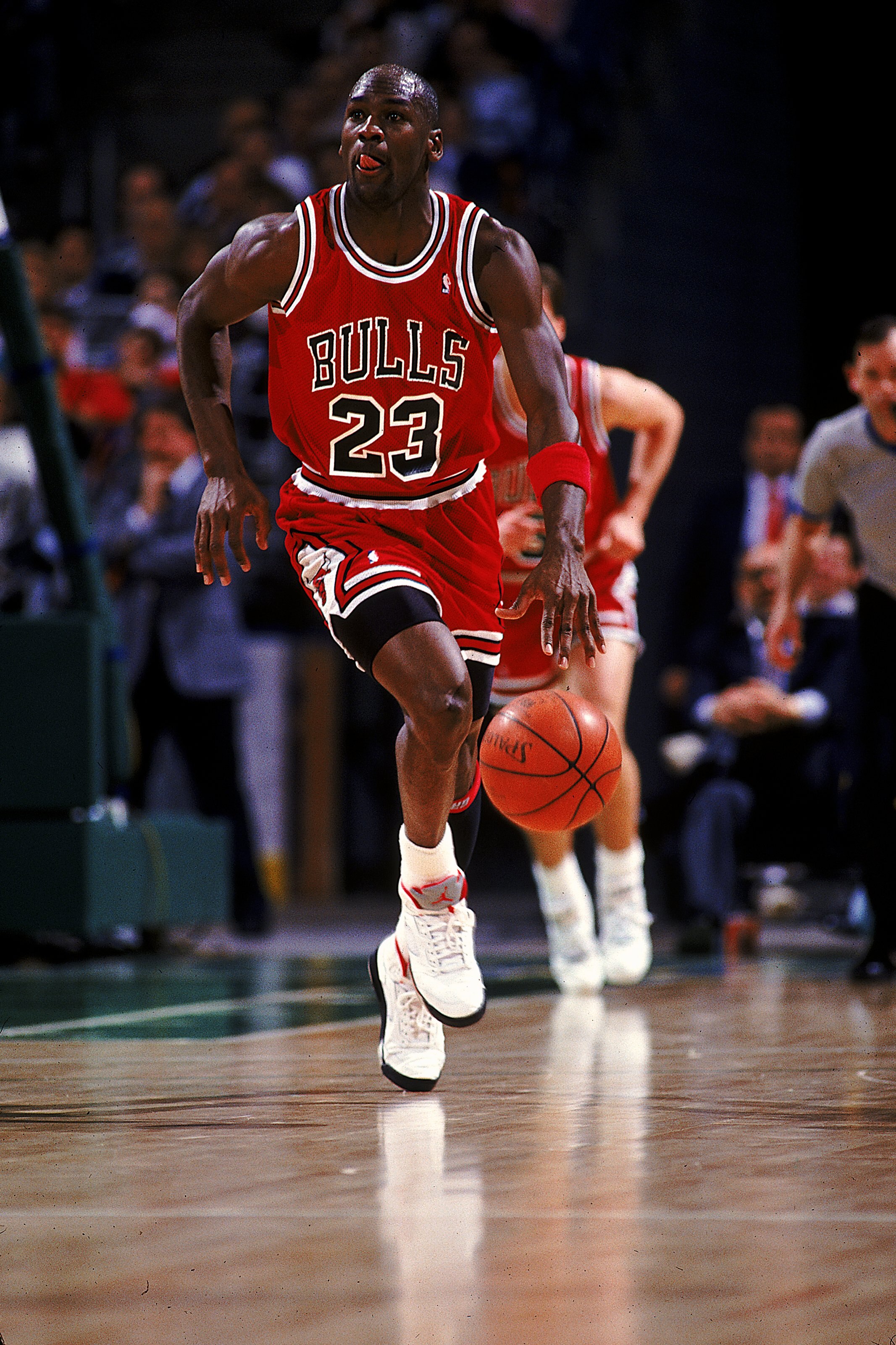 1990:  Michael Jordan #23 of the Chicago Bulls runs with the ball during the game.   Mandatory Credit: Allsport  /Allsport