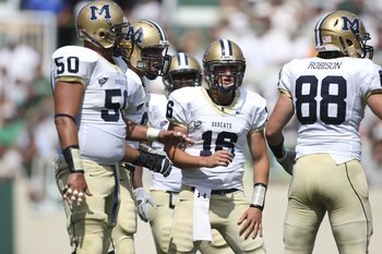 EAST LANSING, MI - SEPTEMBER 05:  Mark Iddins #16 of the Montana State Bobcats calls gathers his team during the first quarter against the Michigan State Spartans in the second quarter on September 5, 2009 at Spartan Stadium in East Lansing, Michigan. (Ph