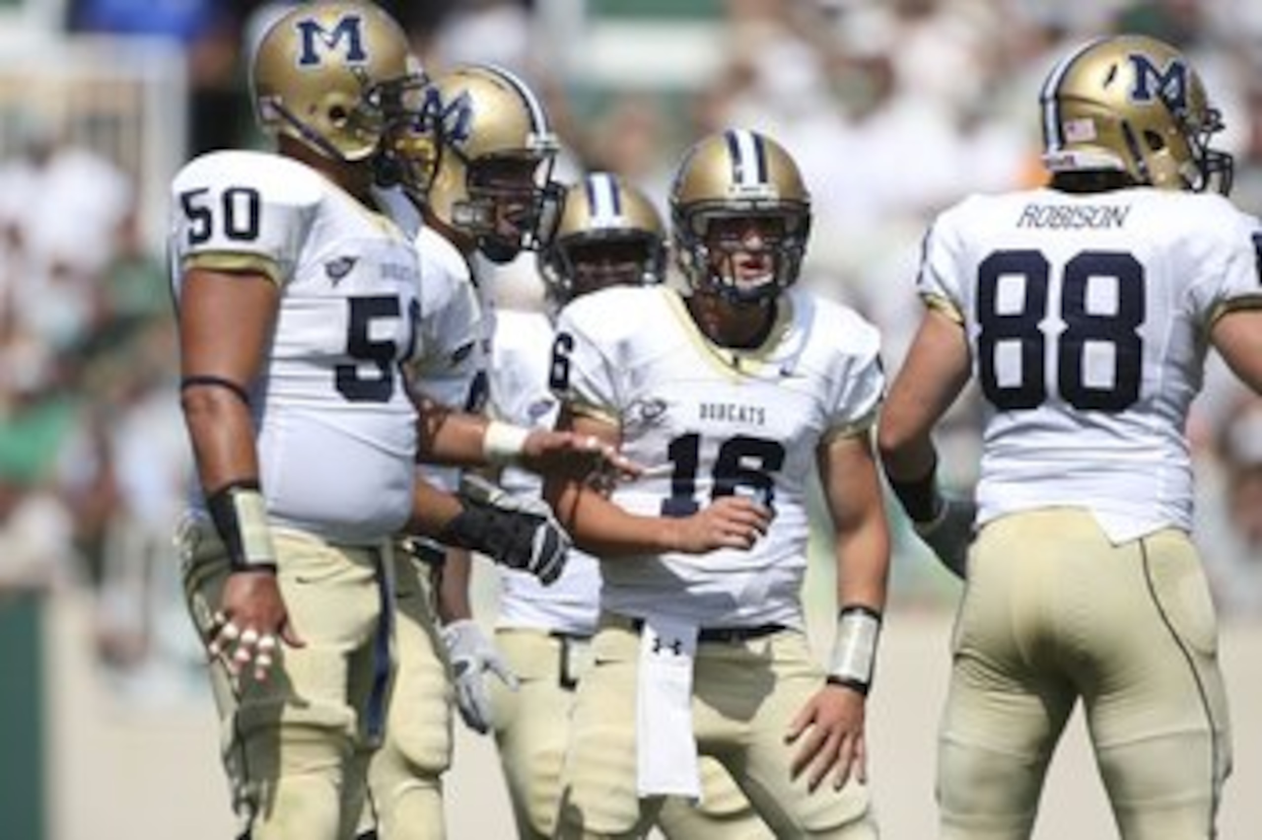 EAST LANSING, MI - SEPTEMBER 05: Mark Iddins #16 of the Montana State Bobcats calls gathers his team during the first quarter against the Michigan State Spartans in the second quarter on September 5, 2009 at Spartan Stadium in East Lansing, Michigan. (Ph EAST LANSING, MI - SEPTEMBER 05: Mark Iddins #16 of the Montana State Bobcats calls gathers his team during the first quarter against the Michigan State Spartans in the second quarter on September 5, 2009 at Spartan Stadium in East Lansing, Michigan. (Ph